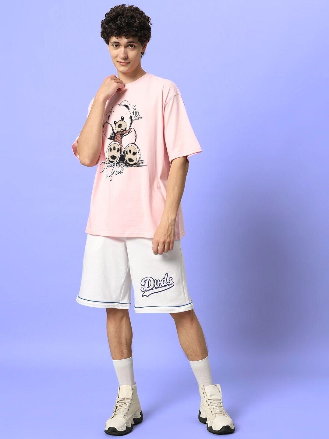 Model wearing CUTE BEAR OVERSIZED T-SHIRT PINK with bear graphic, showcasing trendy oversized fit and casual street style.