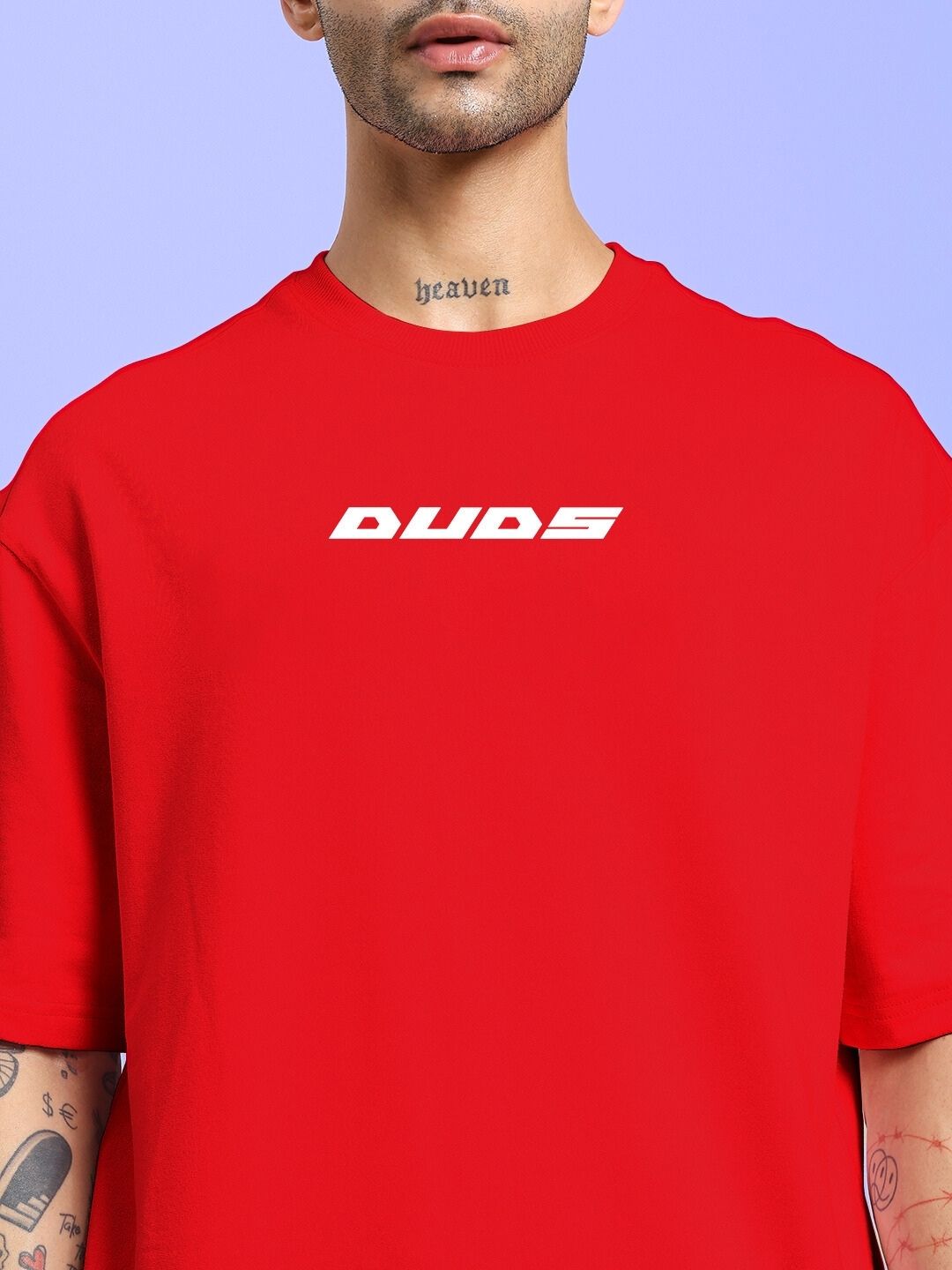 CYBERPUNK OVER-SIZED T-SHIRT RED with bold logo on front, modeled in vibrant setting.