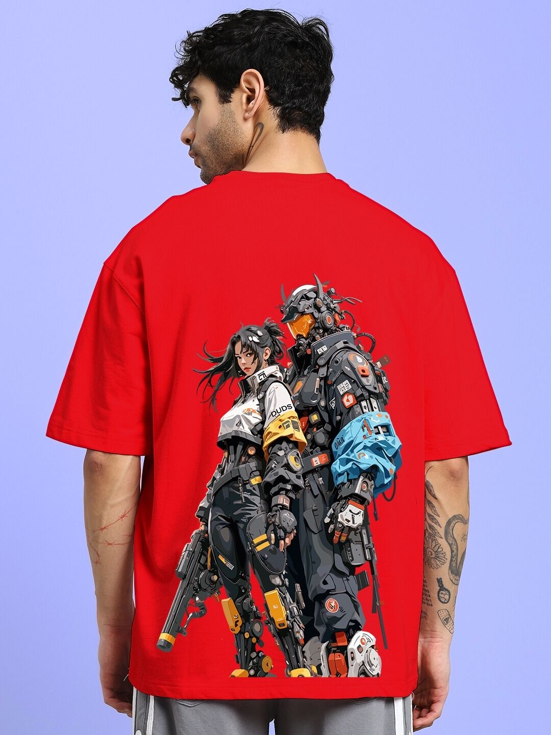 CYBERPUNK OVER-SIZED T-SHIRT RED featuring futuristic design worn by male model, showcasing unique graphic artwork on back.