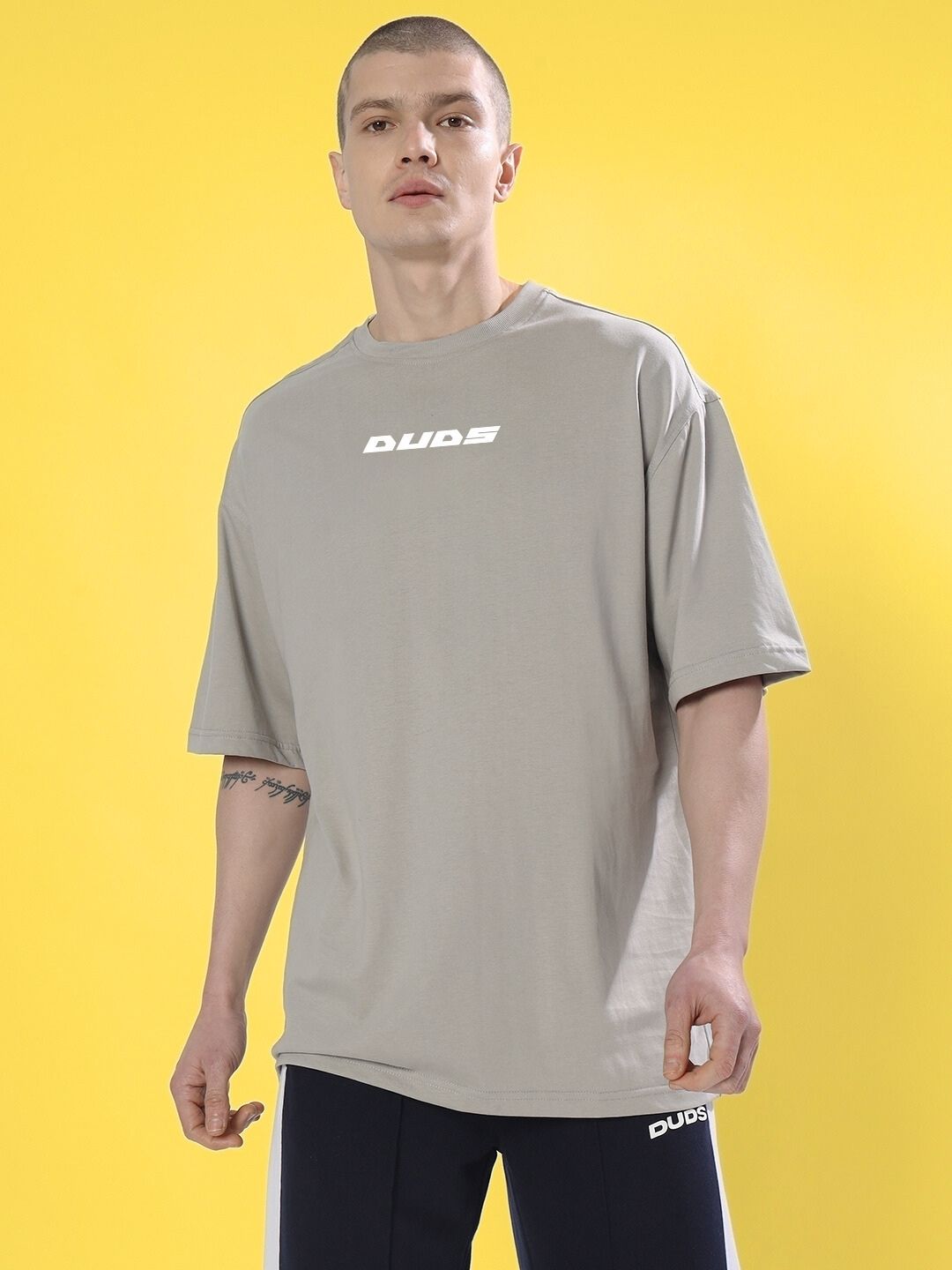 CYBERPUNK OVER-SIZED T-SHIRT GREY on model against yellow background