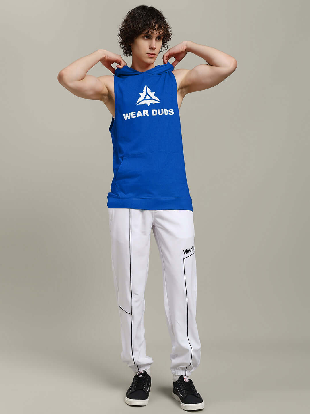 Model wearing the CYBRAN GYM HOODED T-SHIRT BLUE, showcasing its vibrant blue color and athletic design.