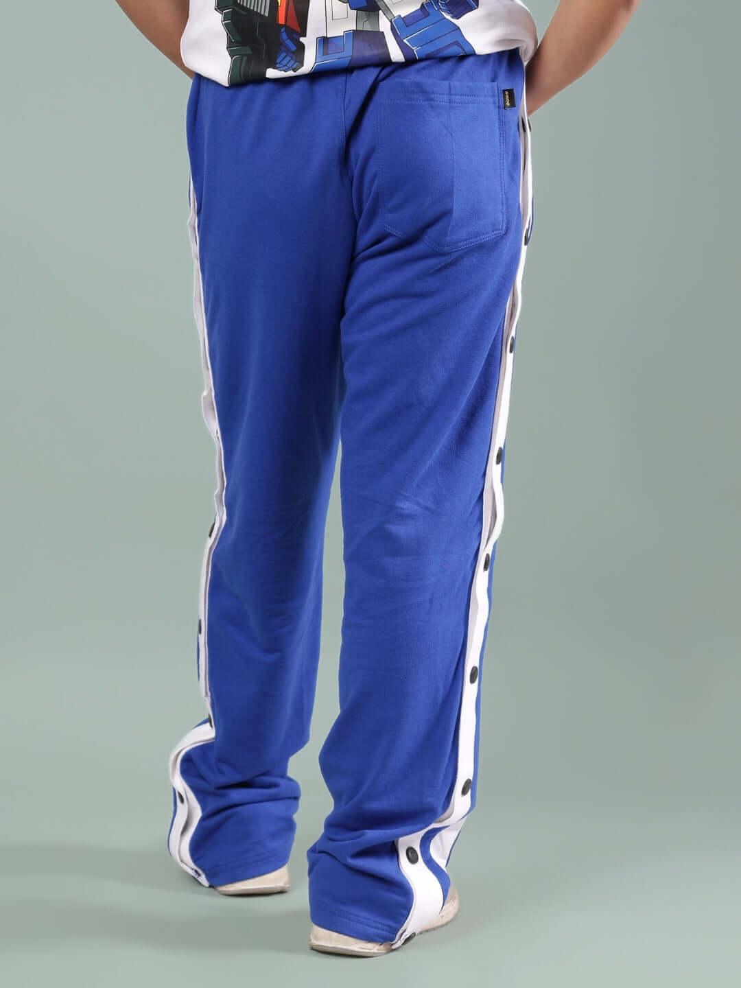 Back view of DANCER JOGGER FOR BOYS & GIRLS ROYAL BLUE highlighting side buttons and pocket design.