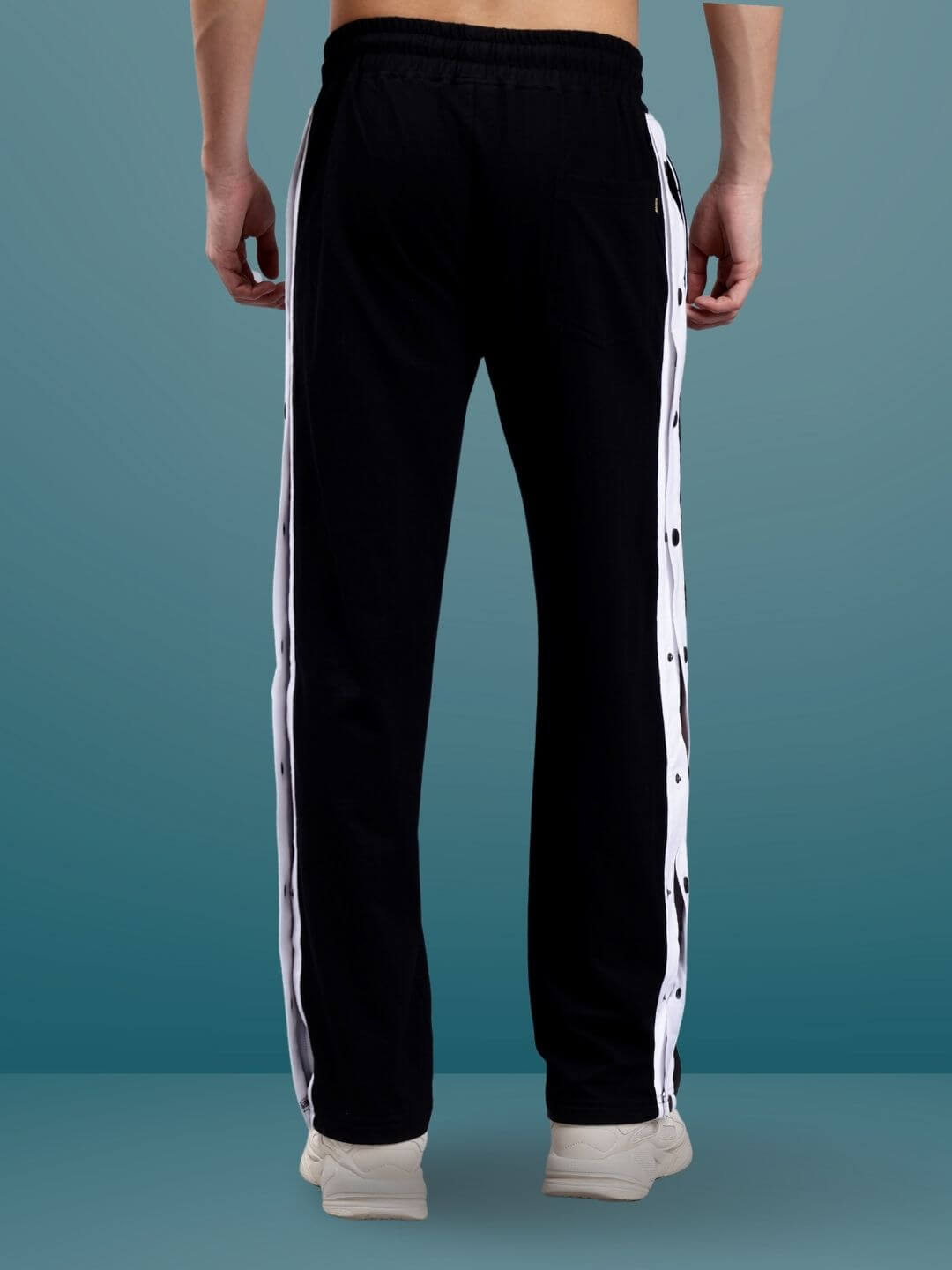 Back view of black and white Dancer Joggers with custom fit option, featuring stylish white side stripes.