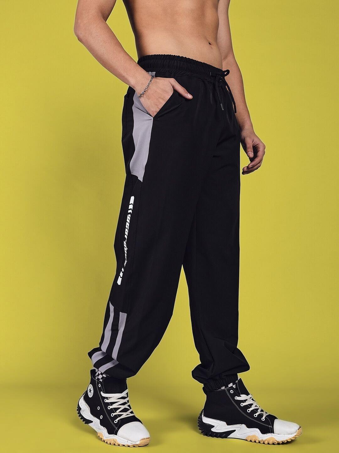 Model wearing black Danny relaxed fit cargo pants with custom fit option, showcasing stylish casual wear for comfort and versatility.