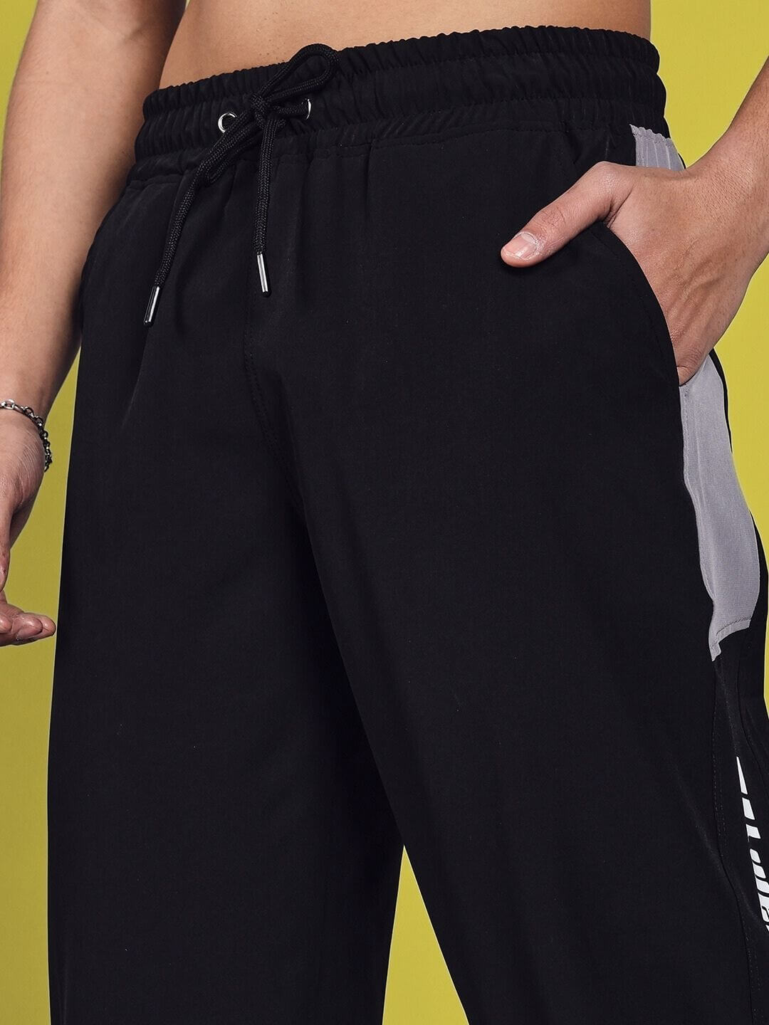 Close-up of DANNY RELAXED FIT CARGO PANTS in black, featuring custom fit option and handmade details, perfect for a personalized style.