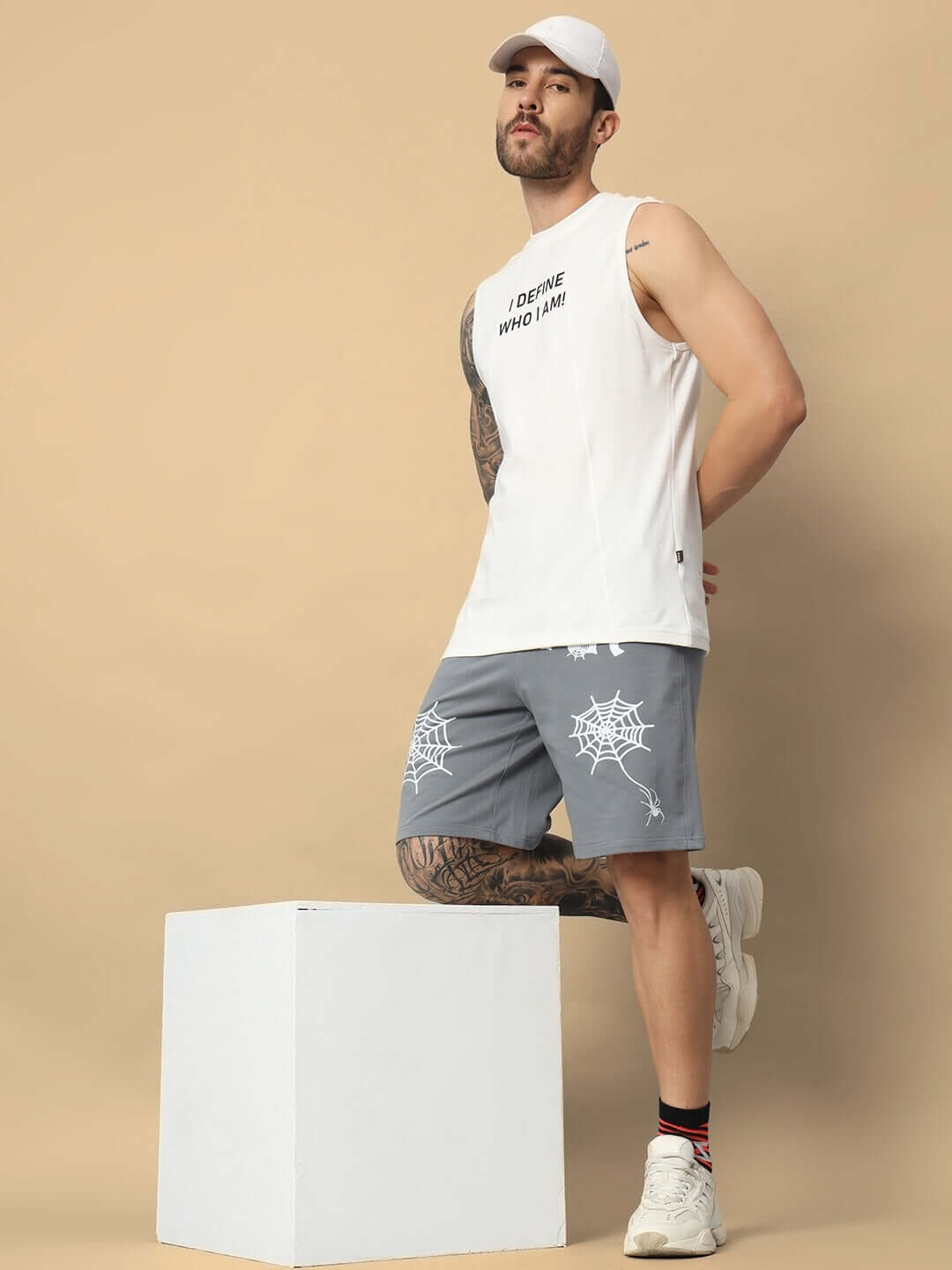 Model wearing Dark Web regular fit grey shorts with custom fit option, showcasing style and comfort for personalized fashion.