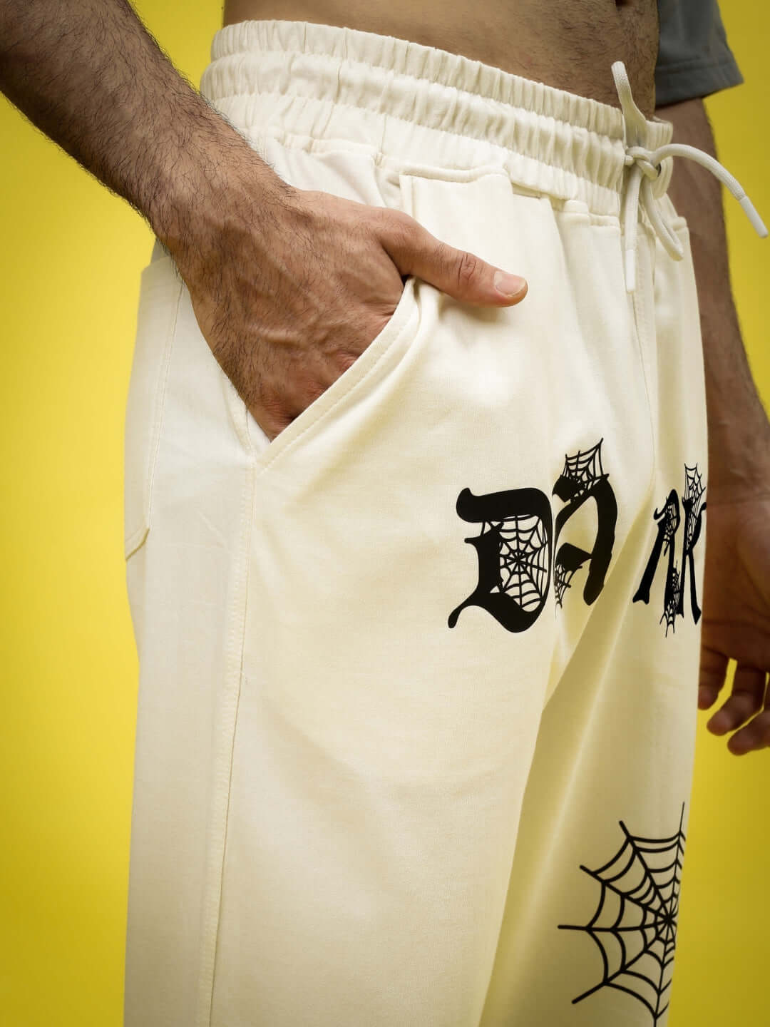 DARK WEB RELAXED JOGGER in off-white with spider web design and drawstring waist, casual men's fashion by DUDS.