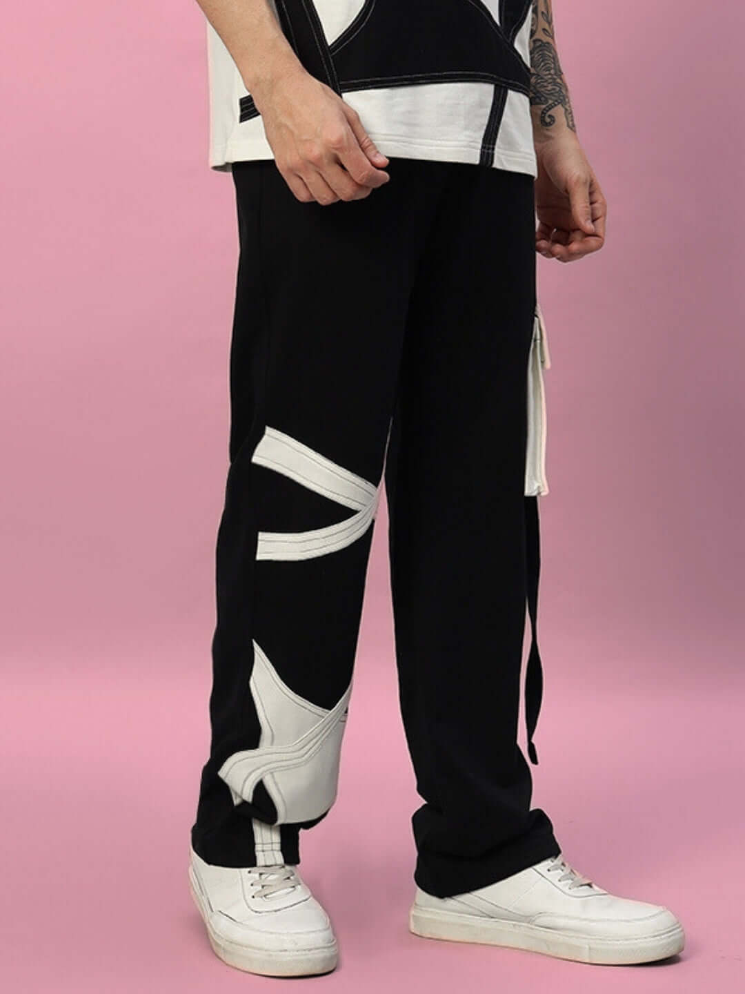 Stylish black DAVID jogger pants with white contrast details, crafted by DUDS tailors, perfect for a custom fit and comfort.