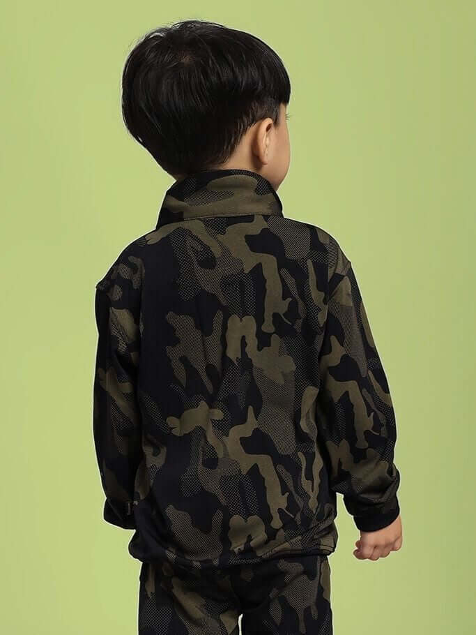 Child wearing DEFENCE CAMOFLAUGE JACKET FOR BOYS AND GIRLS CAMO GREEN on a light background, showcasing camo pattern.