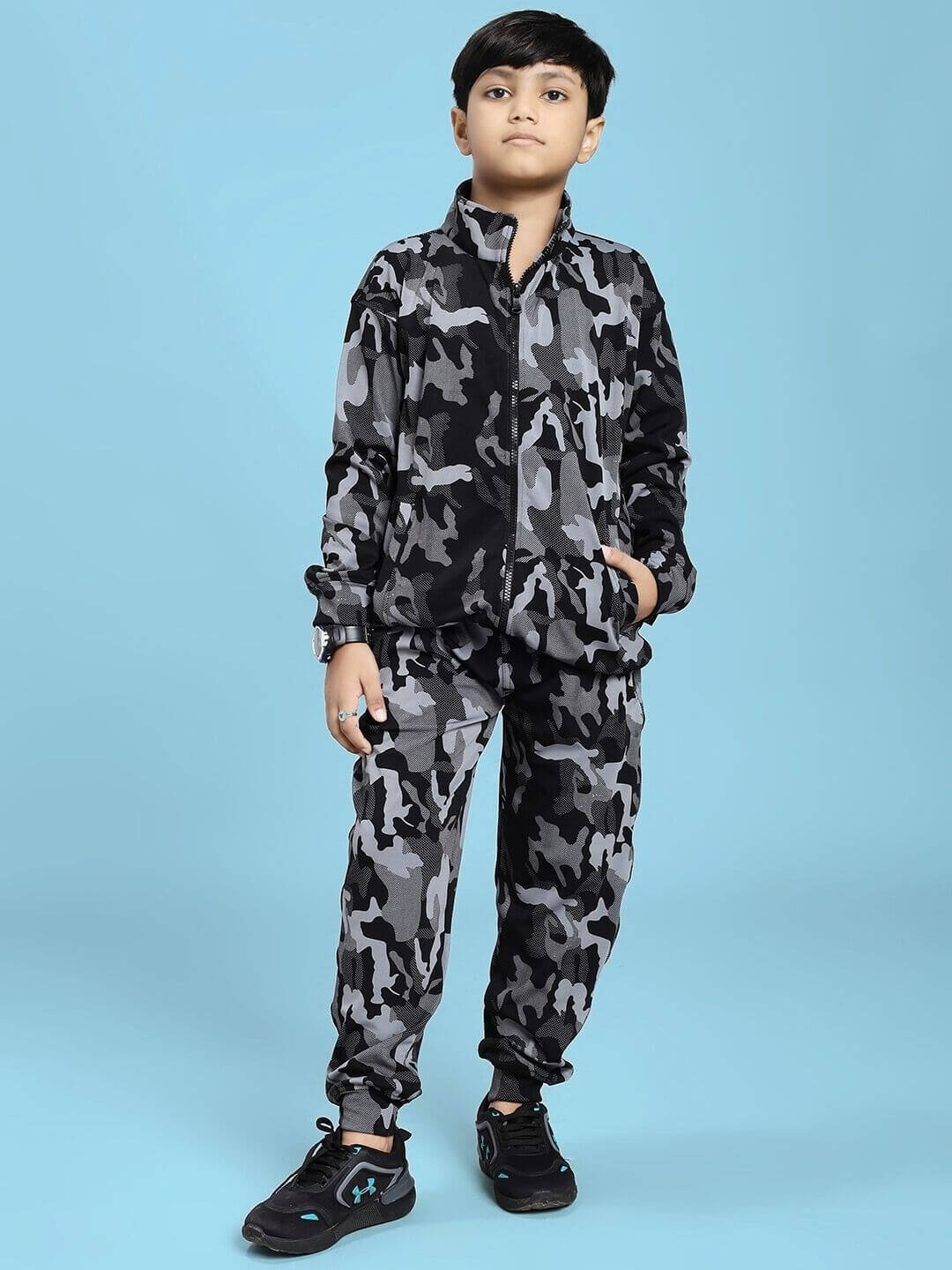 Child wearing DEFENCE CAMOFLAUGE JACKET FOR BOYS AND GIRLS BLACK GREY, standing in a confident pose.
