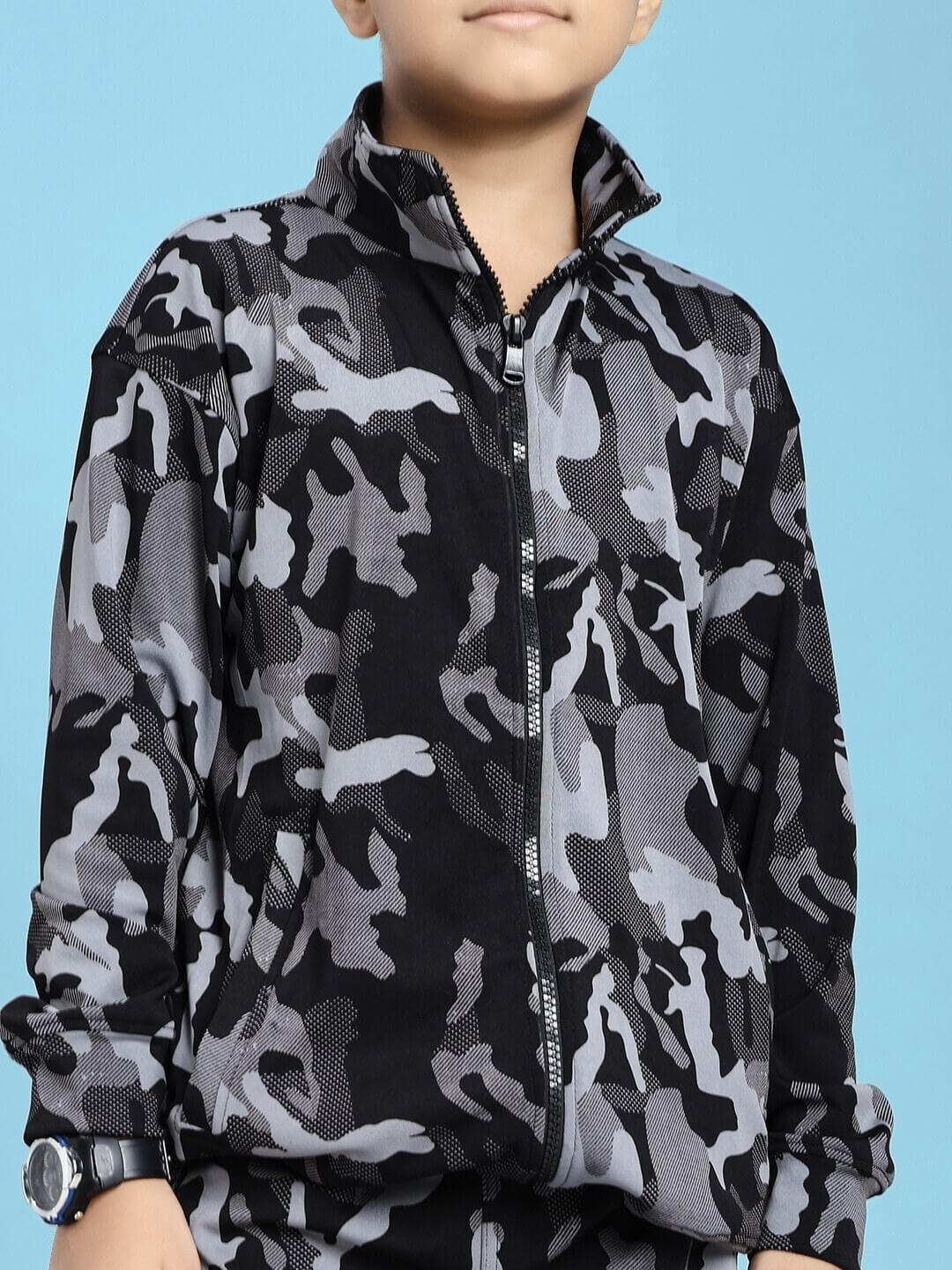 Child wearing DEFENCE CO-ORD SET FOR BOYS AND GIRLS BLACK GREY with camouflage pattern and zipper, showcasing stylish outfit design.