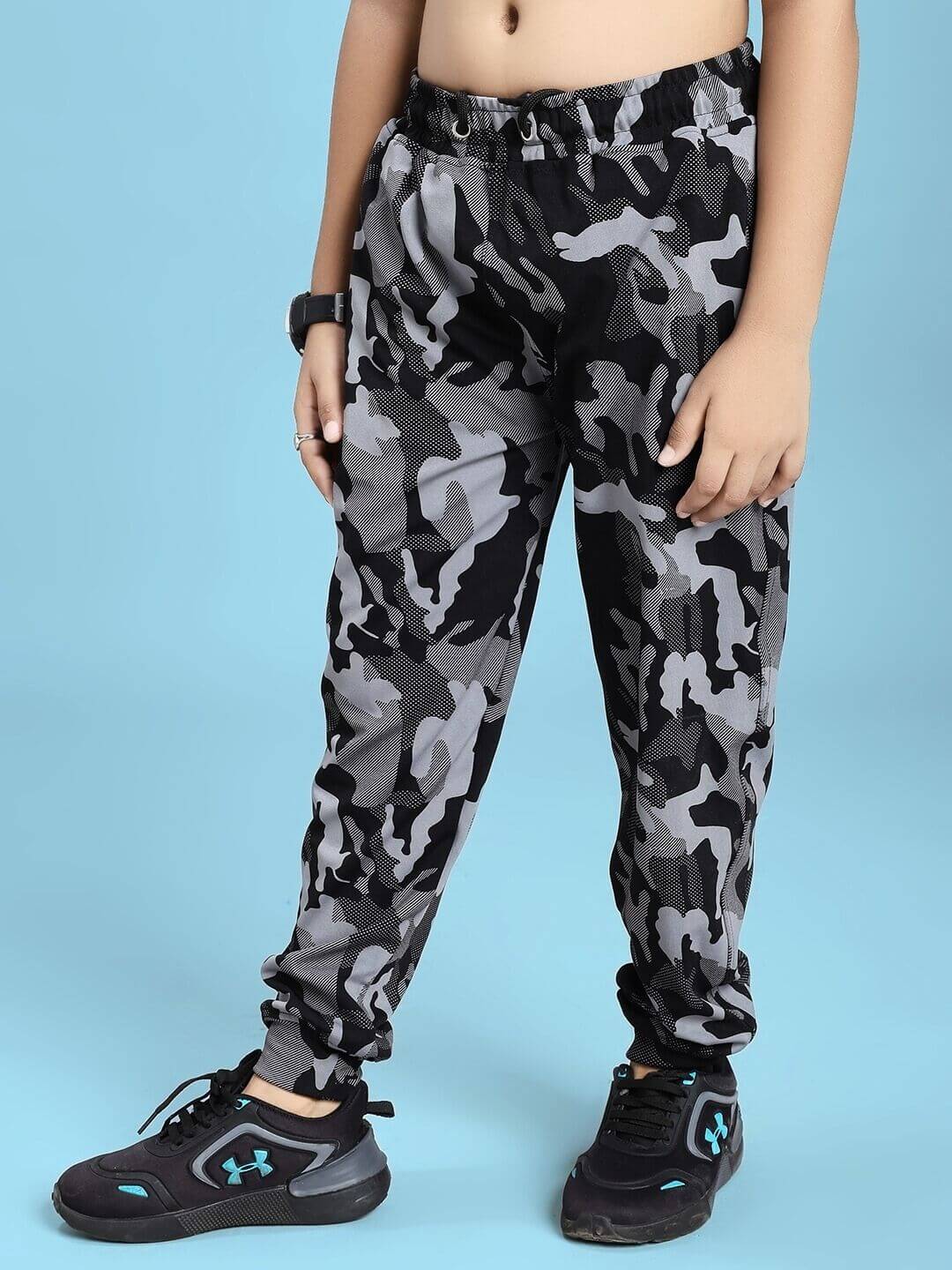 DEFENCE CO-ORD SET FOR BOYS AND GIRLS BLACK GREY with camo print pants and black sneakers.