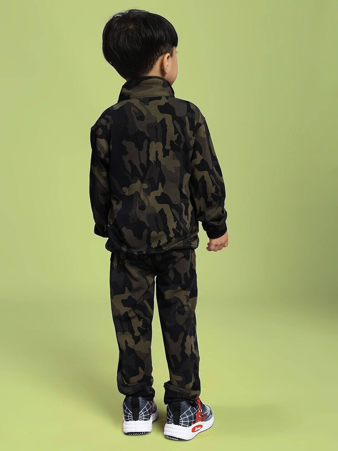 Child wearing DEFENCE CO-ORD SET FOR BOYS AND GIRLS CAMO GREEN, showcasing the camouflage pattern and comfortable fit from behind.