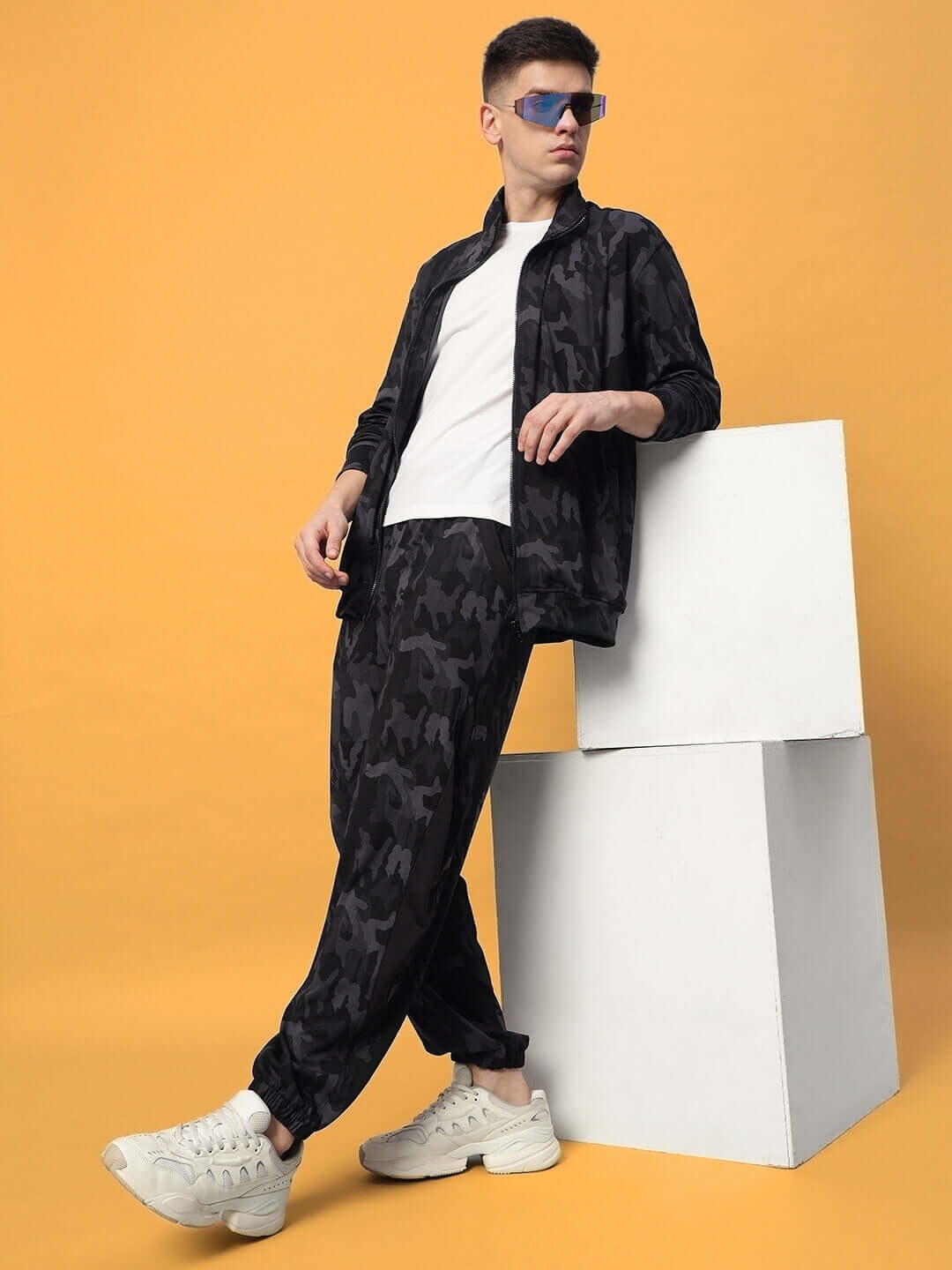 DEFENCE CO-ORD SETS CAMOUFLAGE NAVY worn by model against yellow background for a stylish and adventurous look.