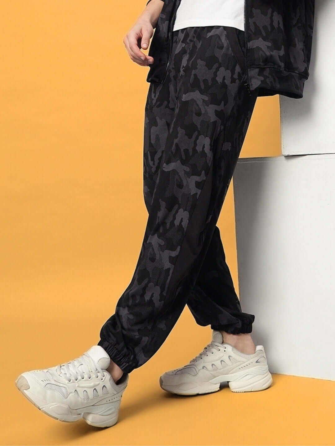Model wearing navy camo Defence Relaxed Pant Jogger by DUDS, highlighting quality craftsmanship and customizable fit options.