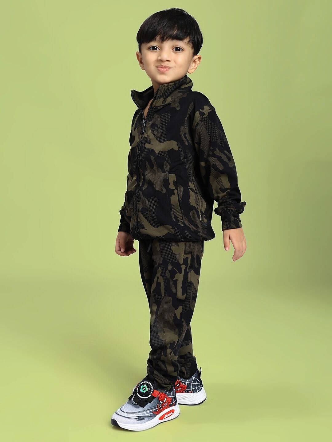 Child wearing DEFENCE CO-ORD SET FOR BOYS AND GIRLS CAMO GREEN with camouflage pattern, perfect for active kids.