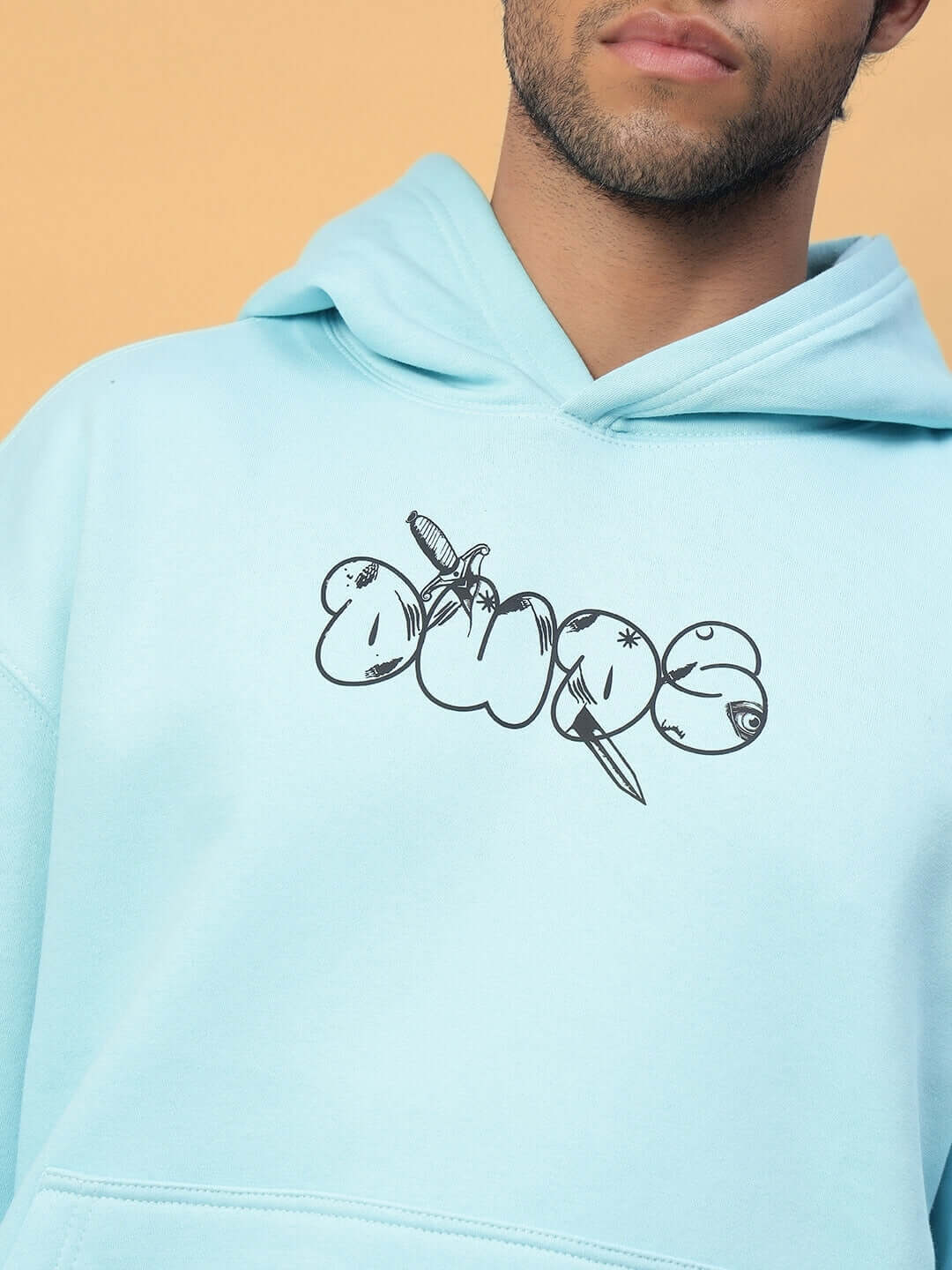 Man wearing WEARDUDS DEMON FLEECE HOODIE SKY BLUE with graphic design on chest
