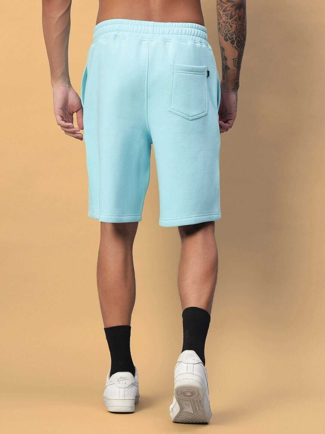 Rear view of WEARDUDS DEMON FLEECE SHORTS SKY BLUE on person