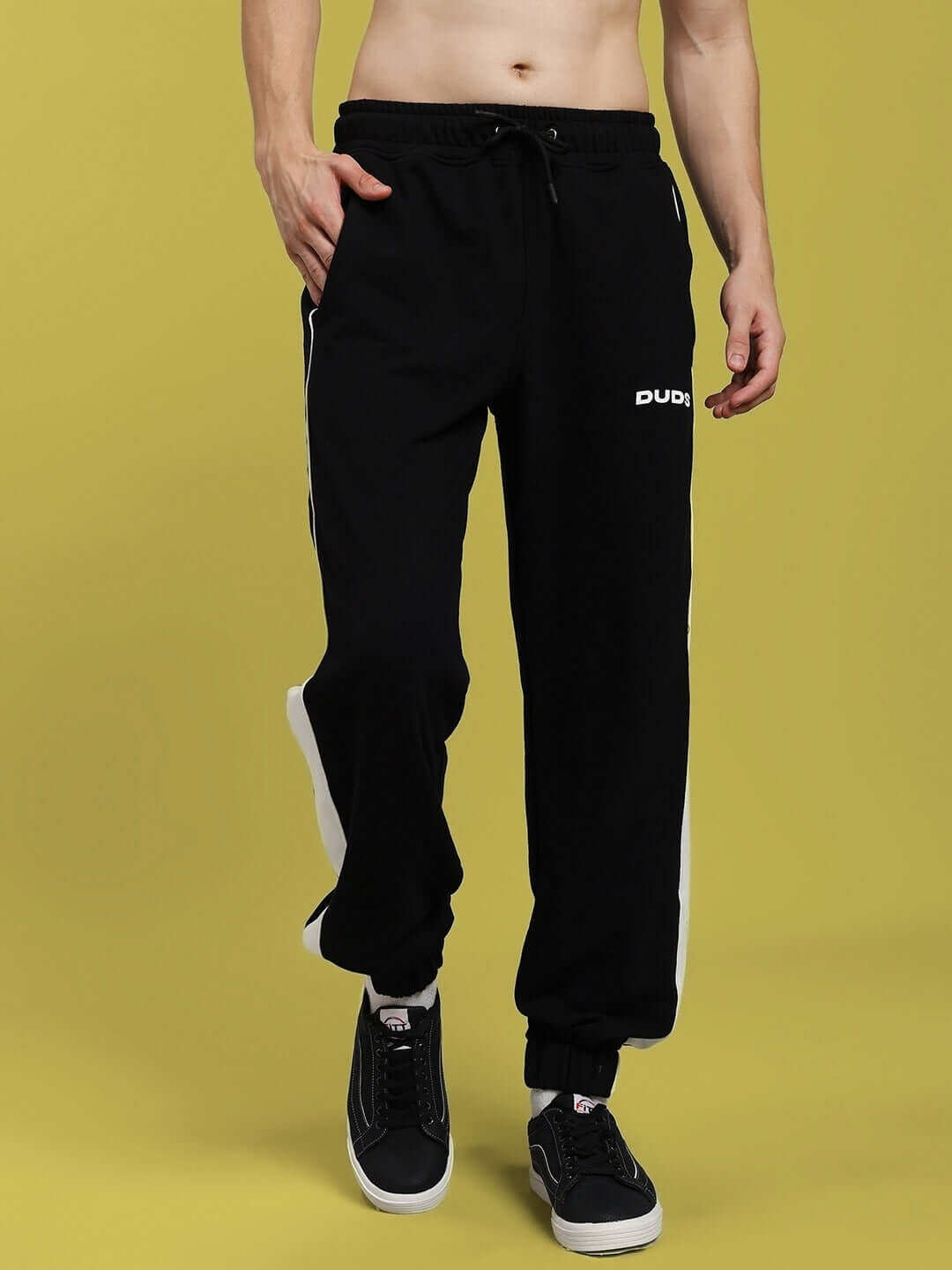 Model wearing DENVER RELAXED FIT JOGGERS BLACK in casual setting, showcasing comfortable and versatile design.