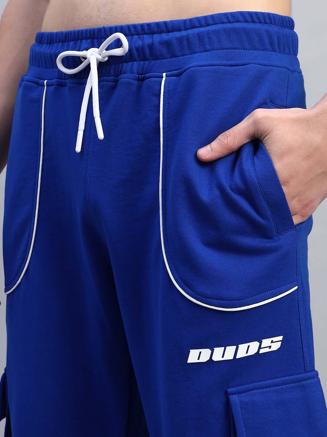 DEVENO RELAXED-FIT JOGGERS BLUE with drawstring waist and side pockets for comfortable and stylish wear.