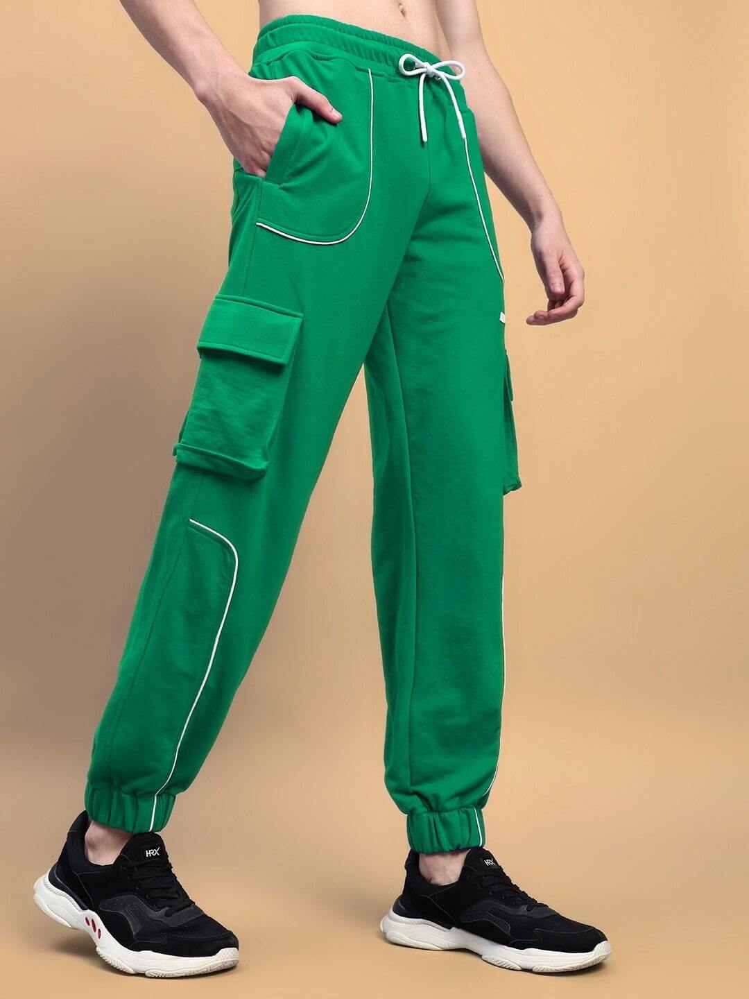 Person wearing DEVENO RELAXED-FIT JOGGERS GREEN with elasticated waistband and premium cotton blend for comfort.