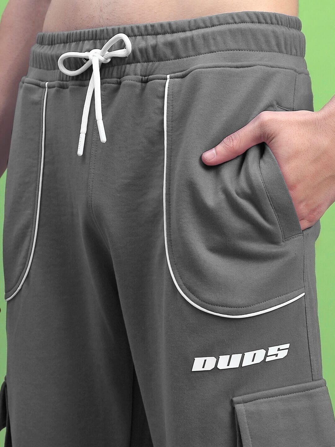 Close-up of DEVENO RELAXED-FIT JOGGERS GREY showcasing elastic waistband and pockets.