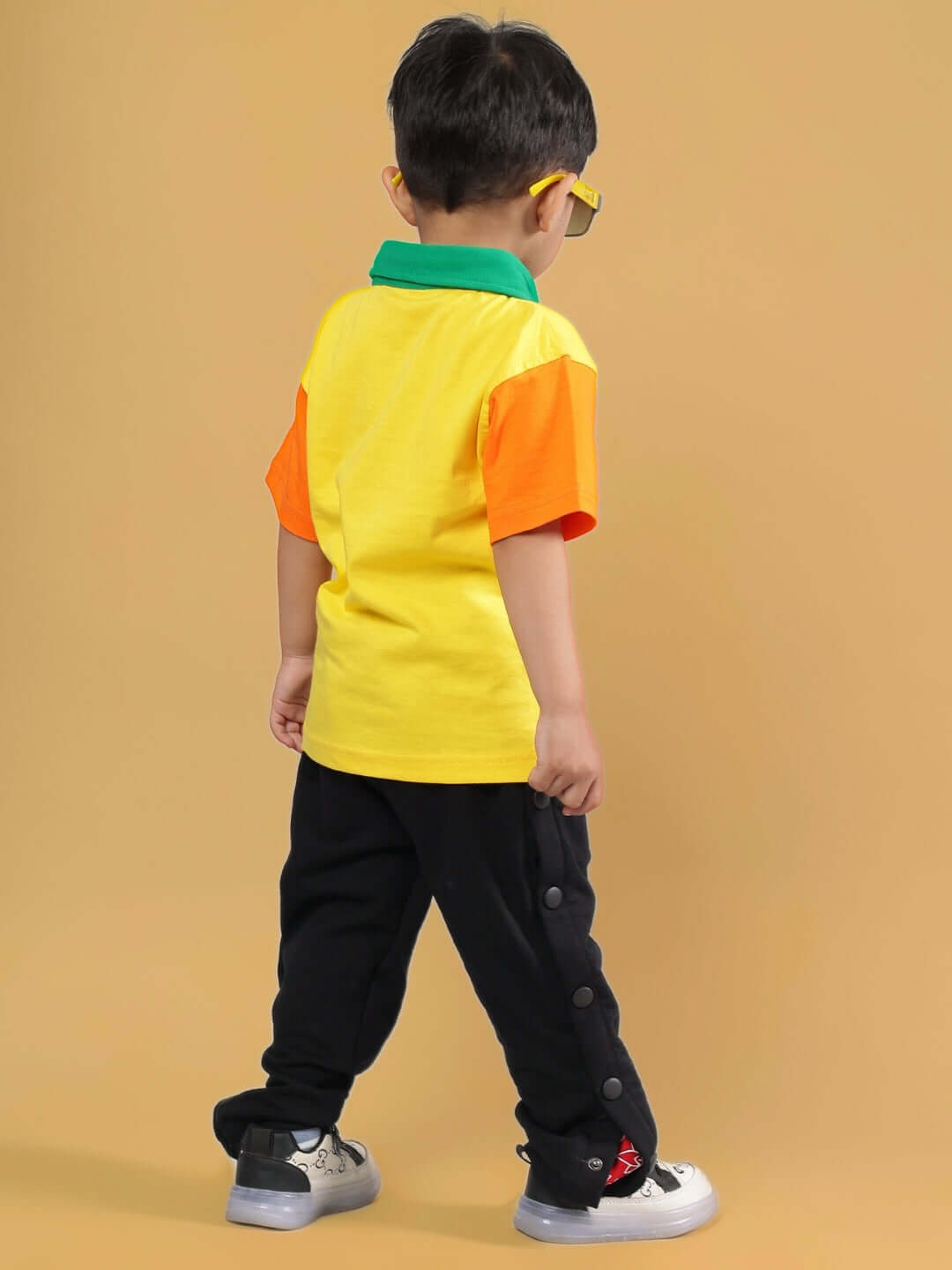 Child wearing DIBRU CO-ORD FOR BOYS & GIRLS YELLOW-BLACK outfit, showing colorful design.