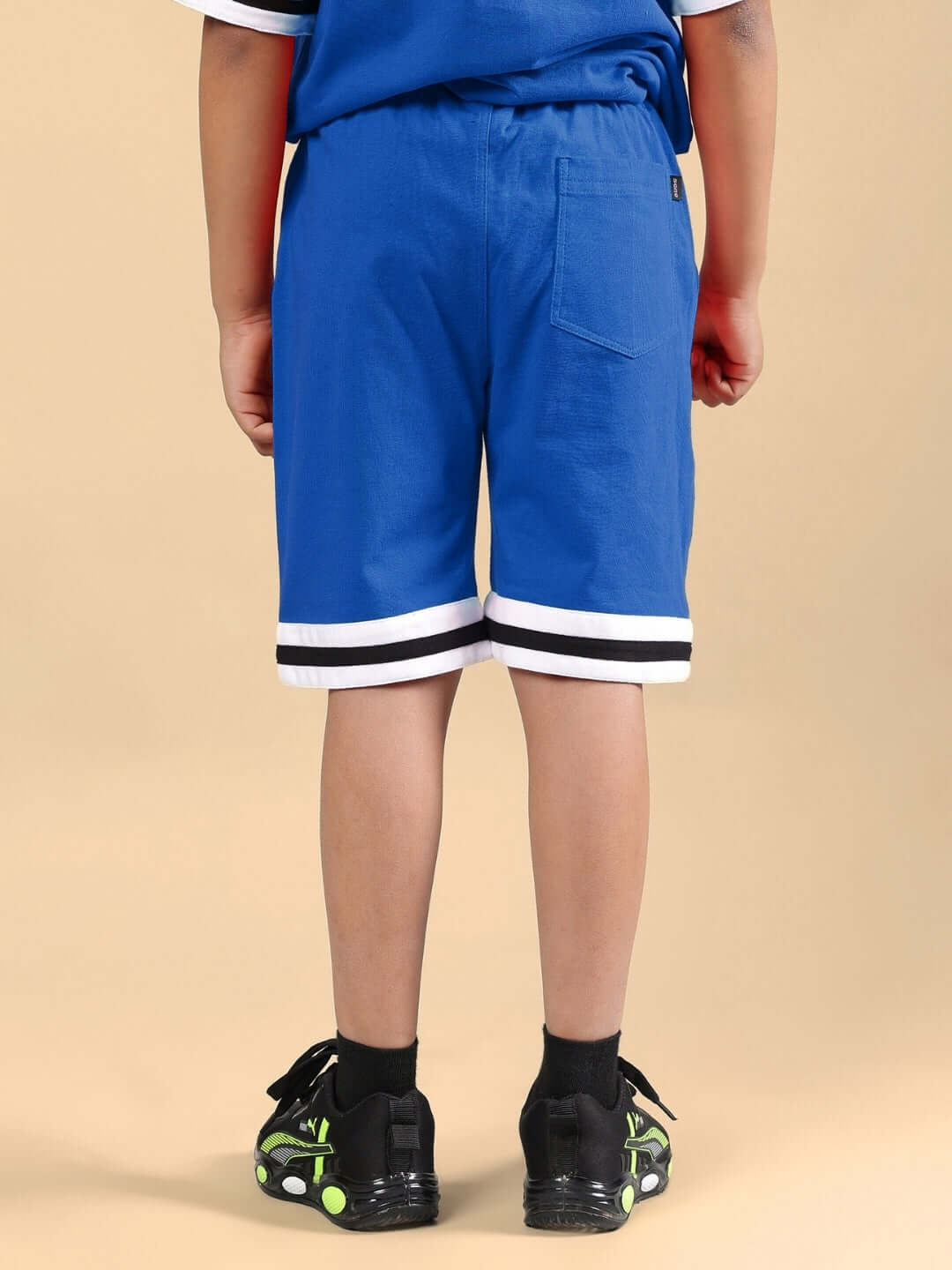 Back view of DIGGIN CO-ORD FOR BOYS & GIRLS BLUE showing shorts detail.