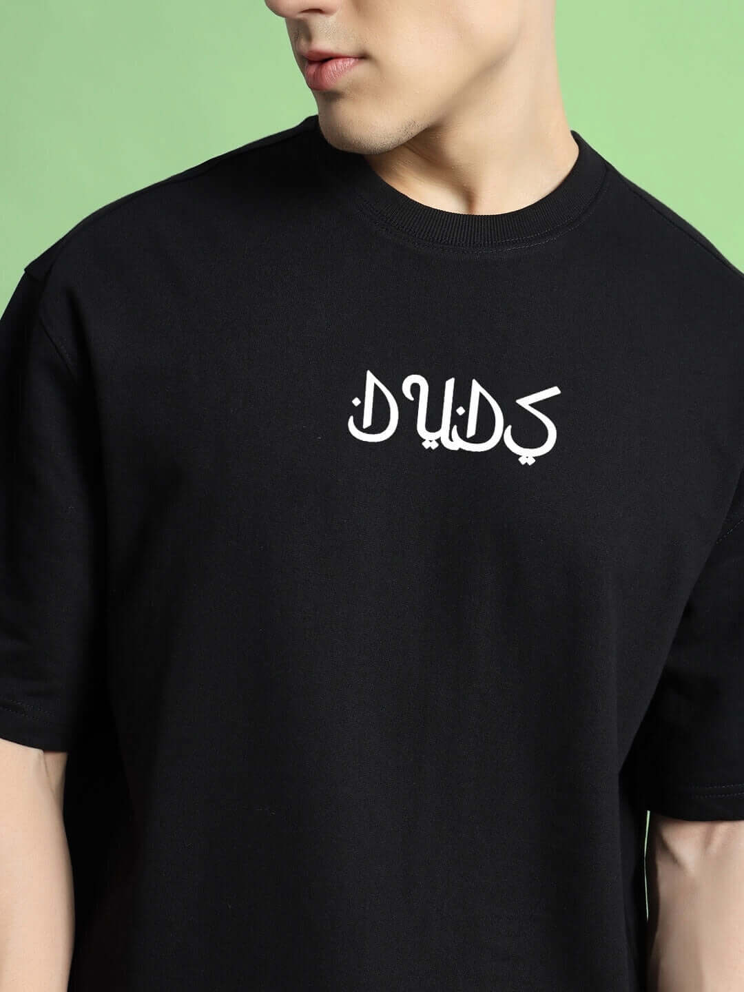Black dimension over-sized t-shirt in premium heavy gauge cotton with a bold graphic, suitable for casual wear.