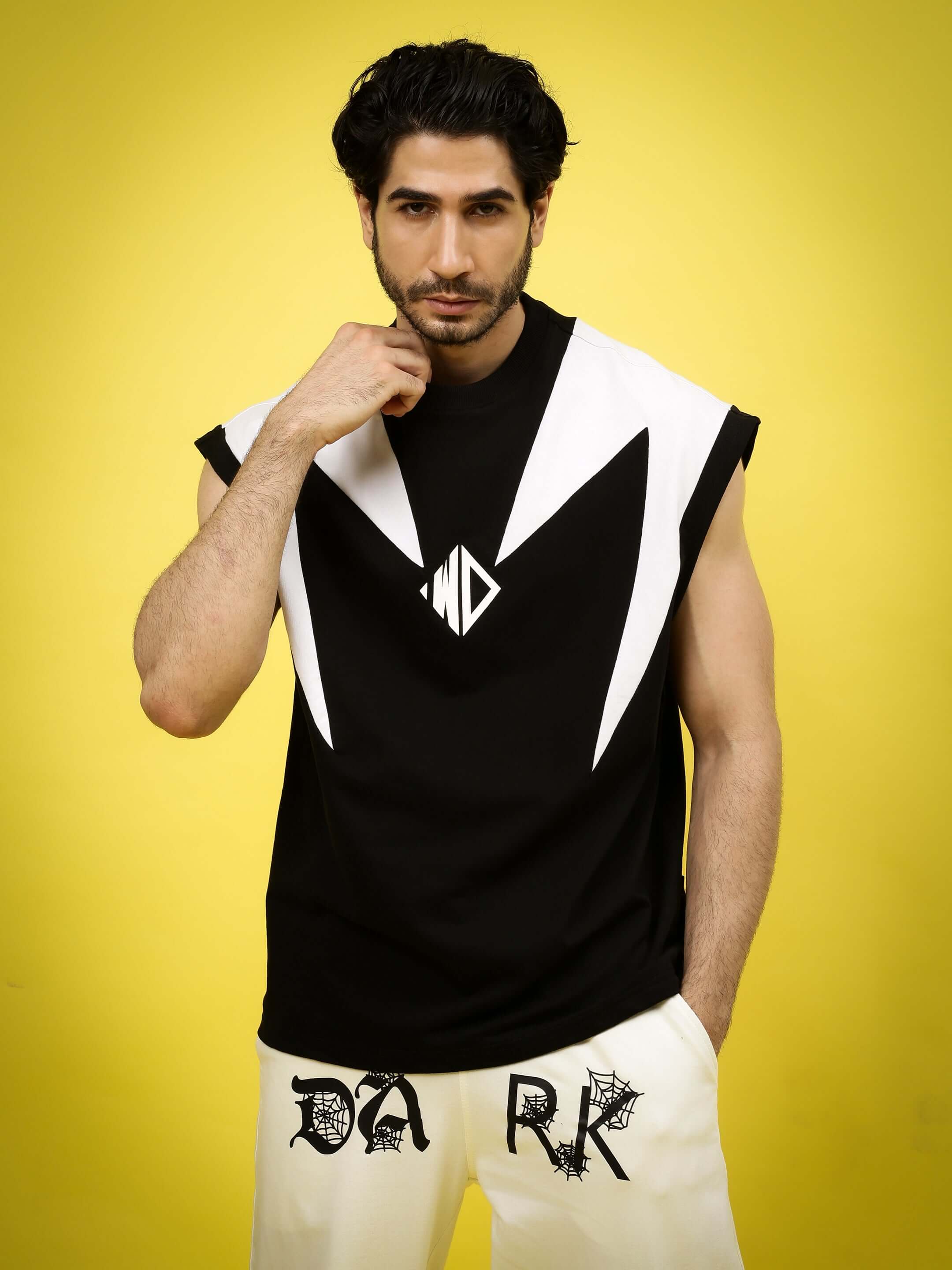 Model wearing Dino Thunder over-sized black T-shirt in premium cotton blend, featuring bold design, suitable for casual style.