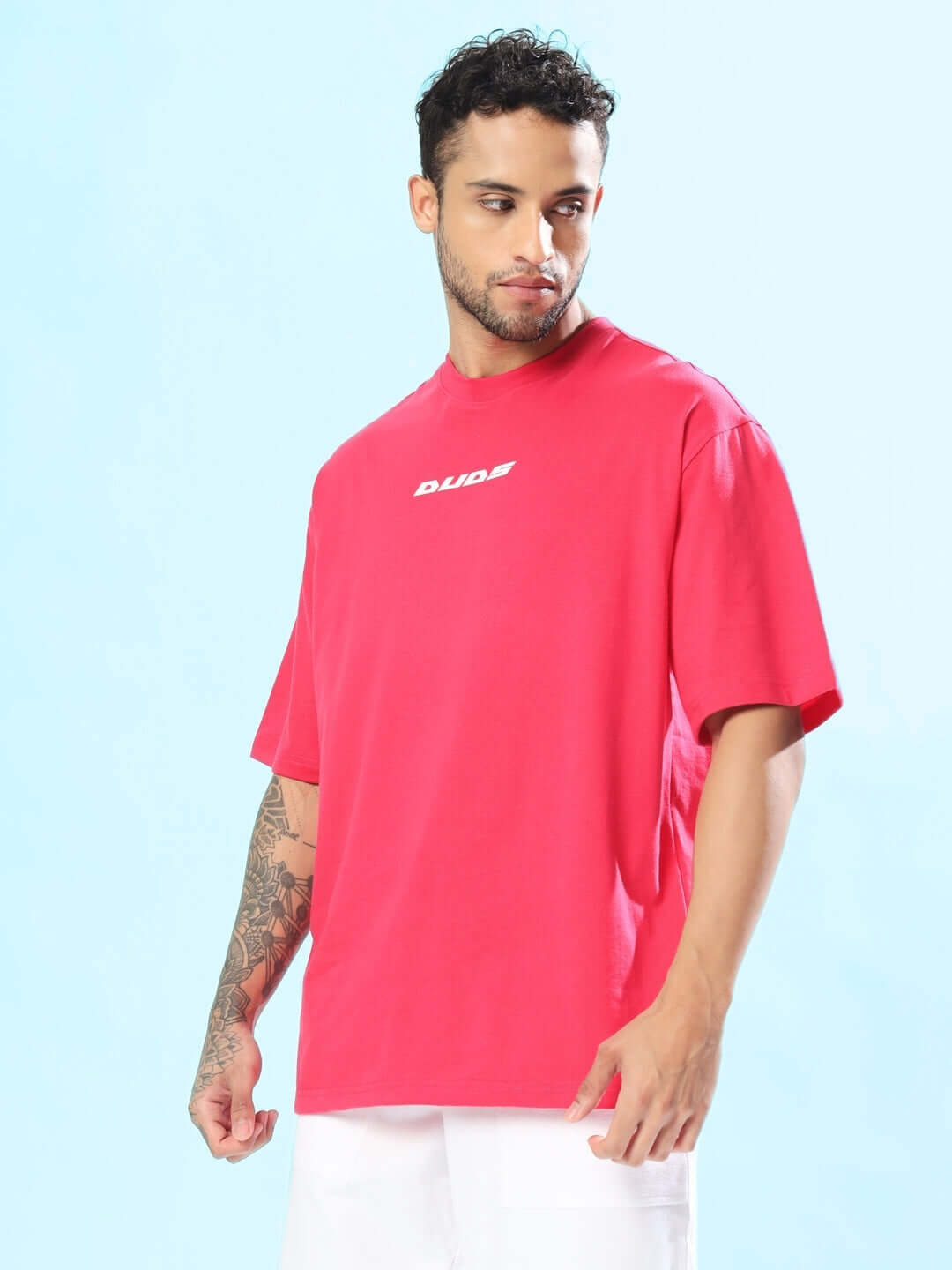 Man wearing a pink Disney Lilo oversized T-shirt from DUDS, featuring a casual fit, perfect for custom sizing and tailored comfort.