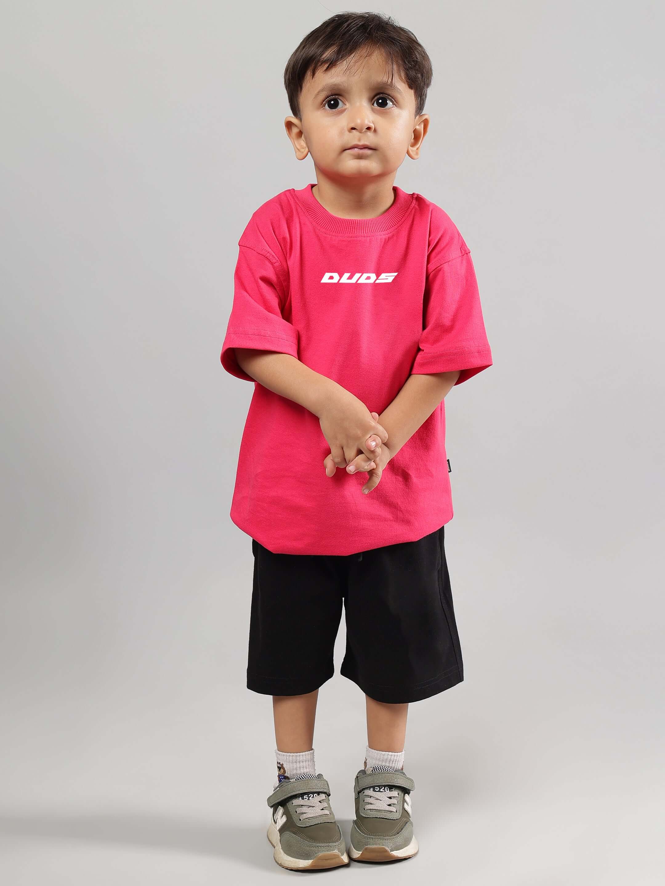 Child wearing Disney Lilo Co-Ord for Boys Girls Pink-Black, featuring a comfortable pink T-shirt and black shorts, made from 100% cotton.