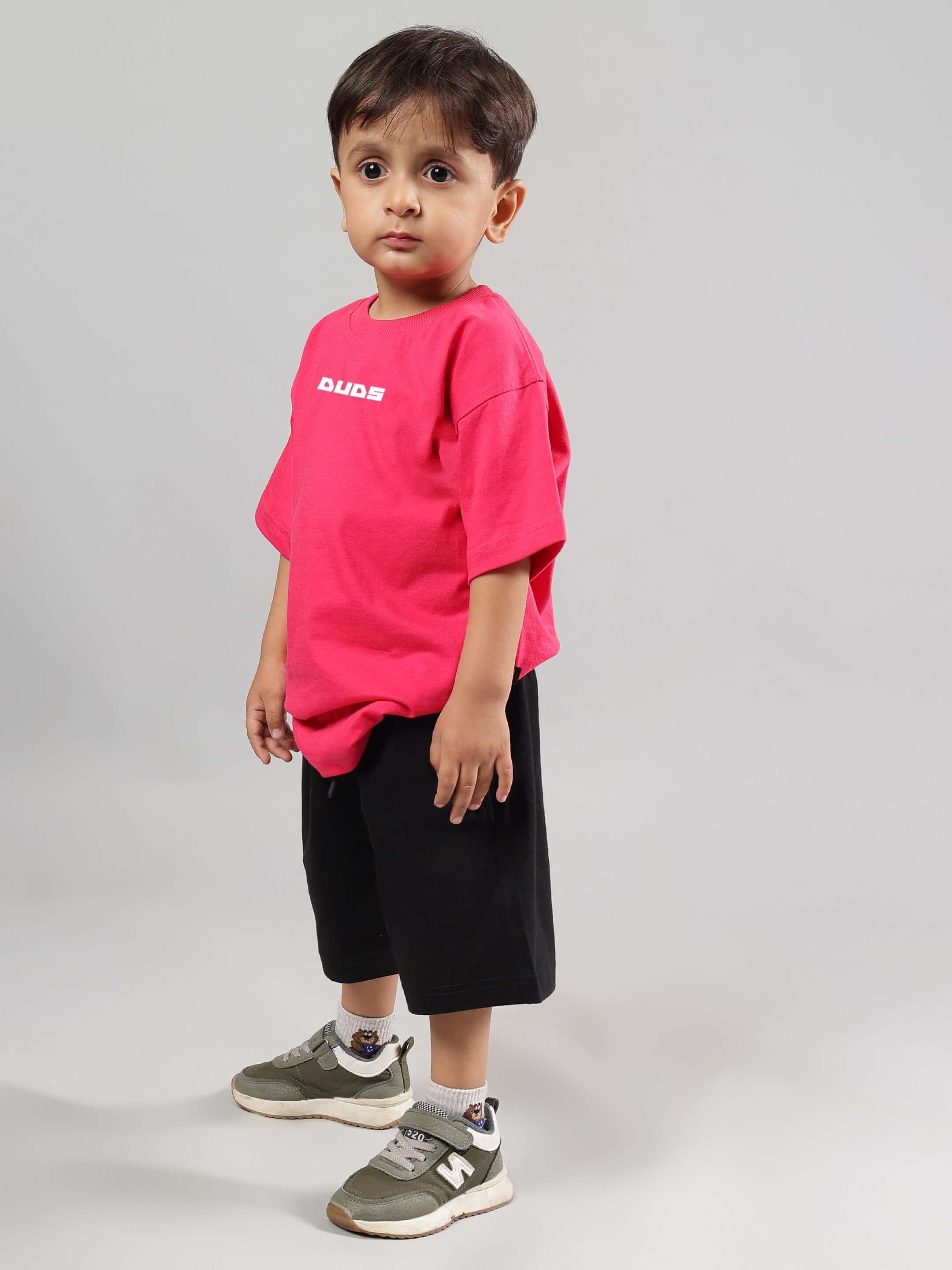 Child wearing DISNEY LILO CO-ORD FOR BOYS GIRLS PINK-BLACK consisting of a pink shirt and black shorts, showcasing comfortable and stylish kidswear.