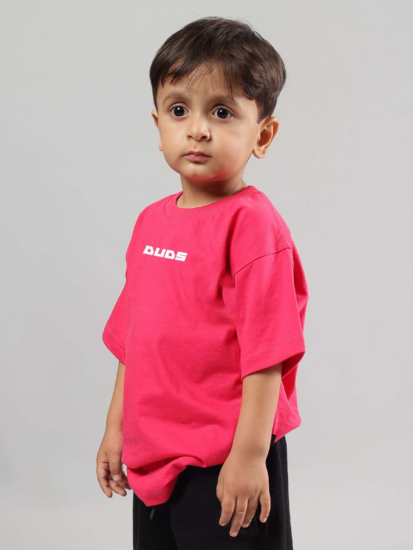 Child wearing a pink Disney Lilo oversized t-shirt for boys and girls by DUDS, featuring a casual and comfortable fit.