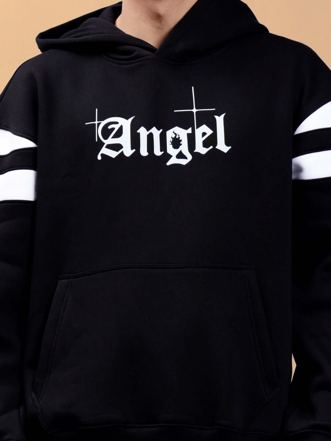 Black oversized hoodie with "Angel" text and white colorblock design, offering a stylish and comfortable casual wear option.