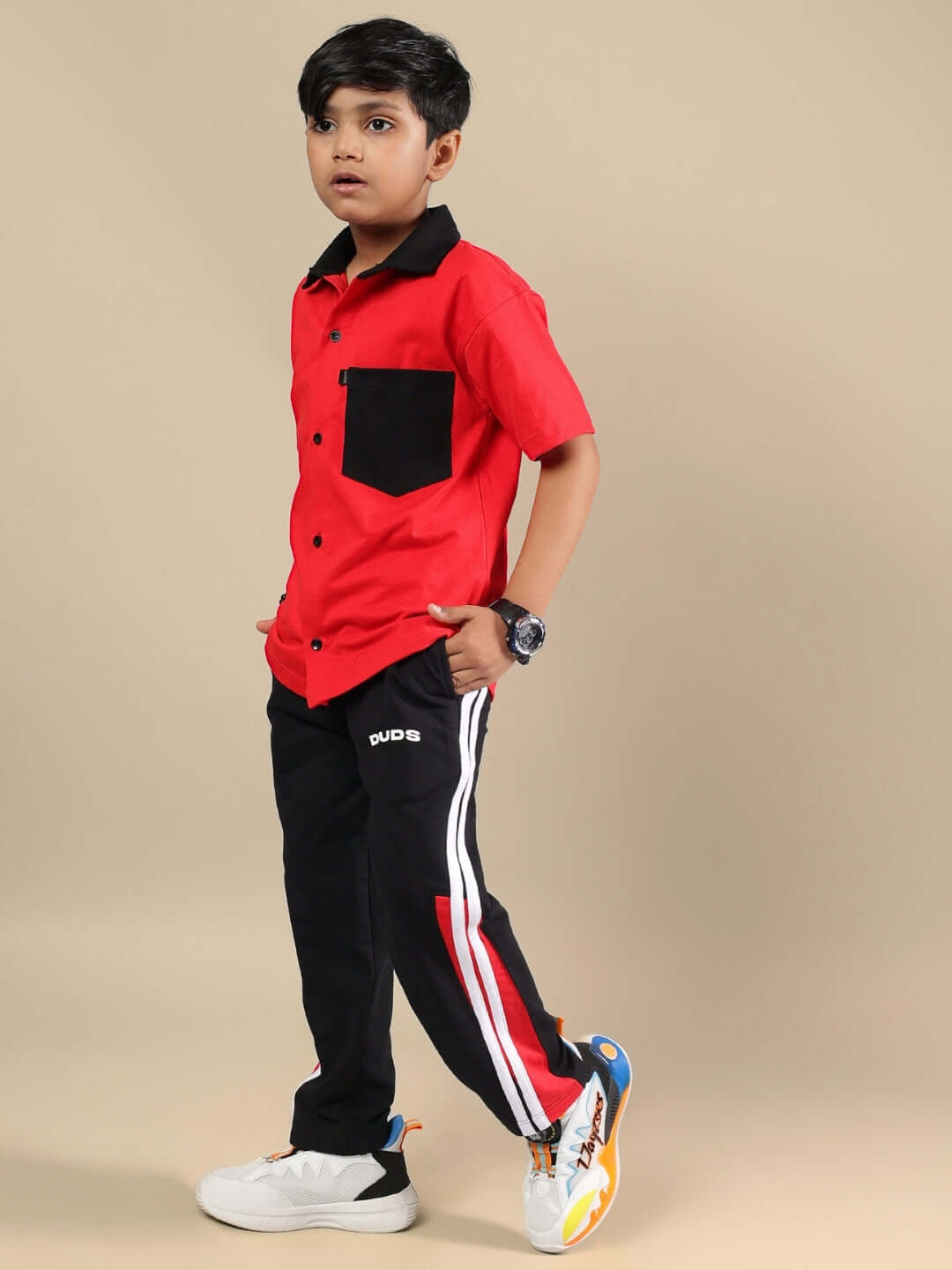 DORIC CO-ORD FOR BOYS & GIRLS RED-BLACK, featuring a sporty red shirt and black pants, perfect for active kids.