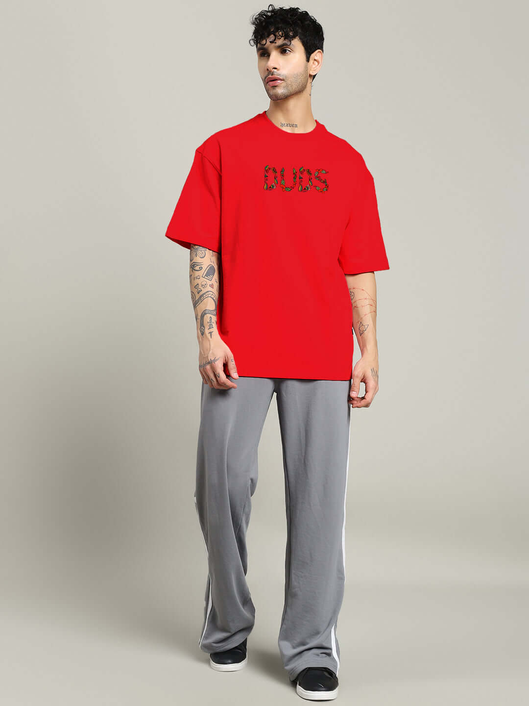 Model wearing red Dragonfly oversized T-shirt made from premium cotton blend, featuring bold front design, ideal for casual fashion.