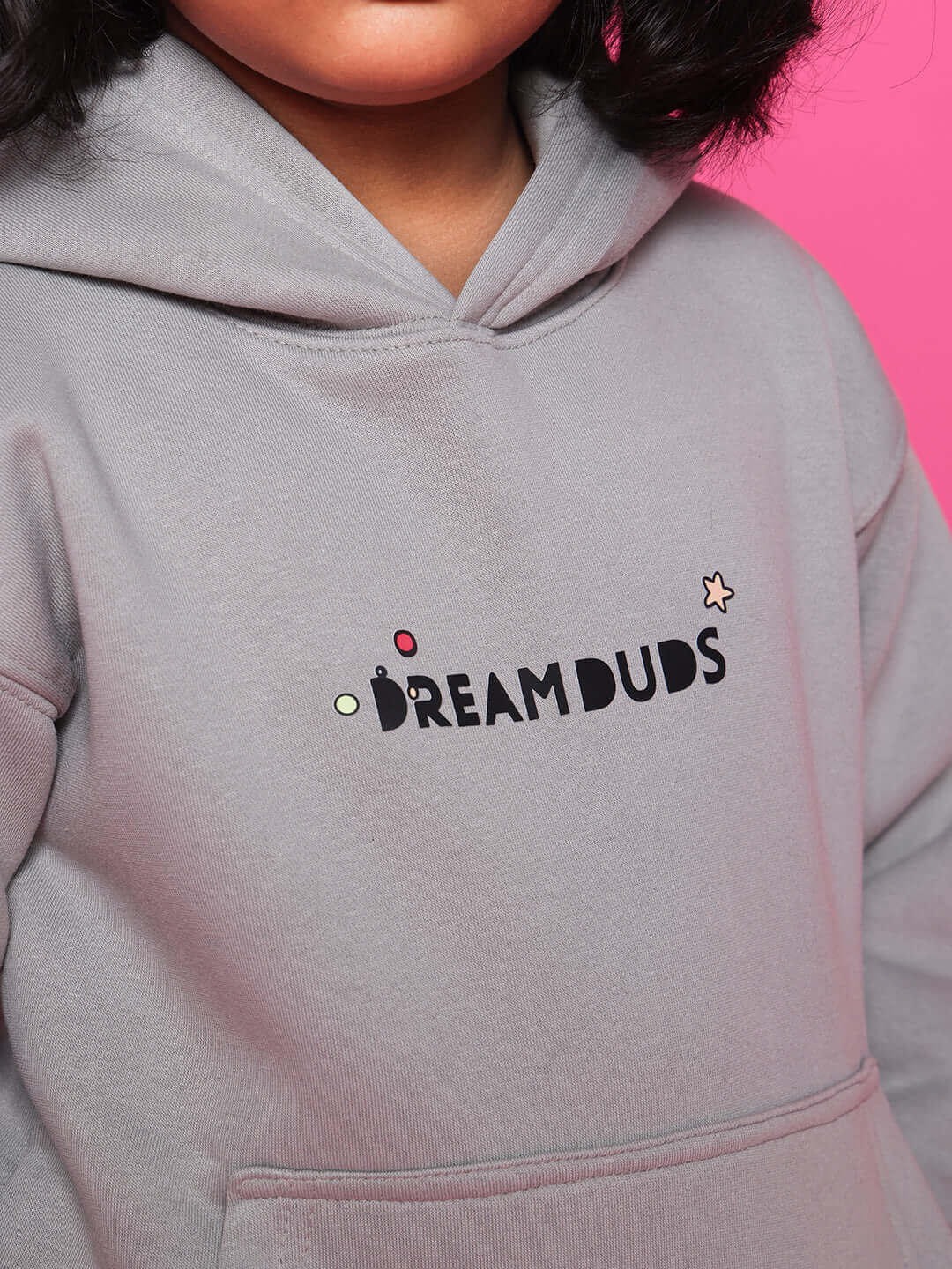 Alt Tag: Grey oversized hoodie for boys and girls by DUDS, featuring DREAM DUDS logo on the front. Ideal for customizable fits.