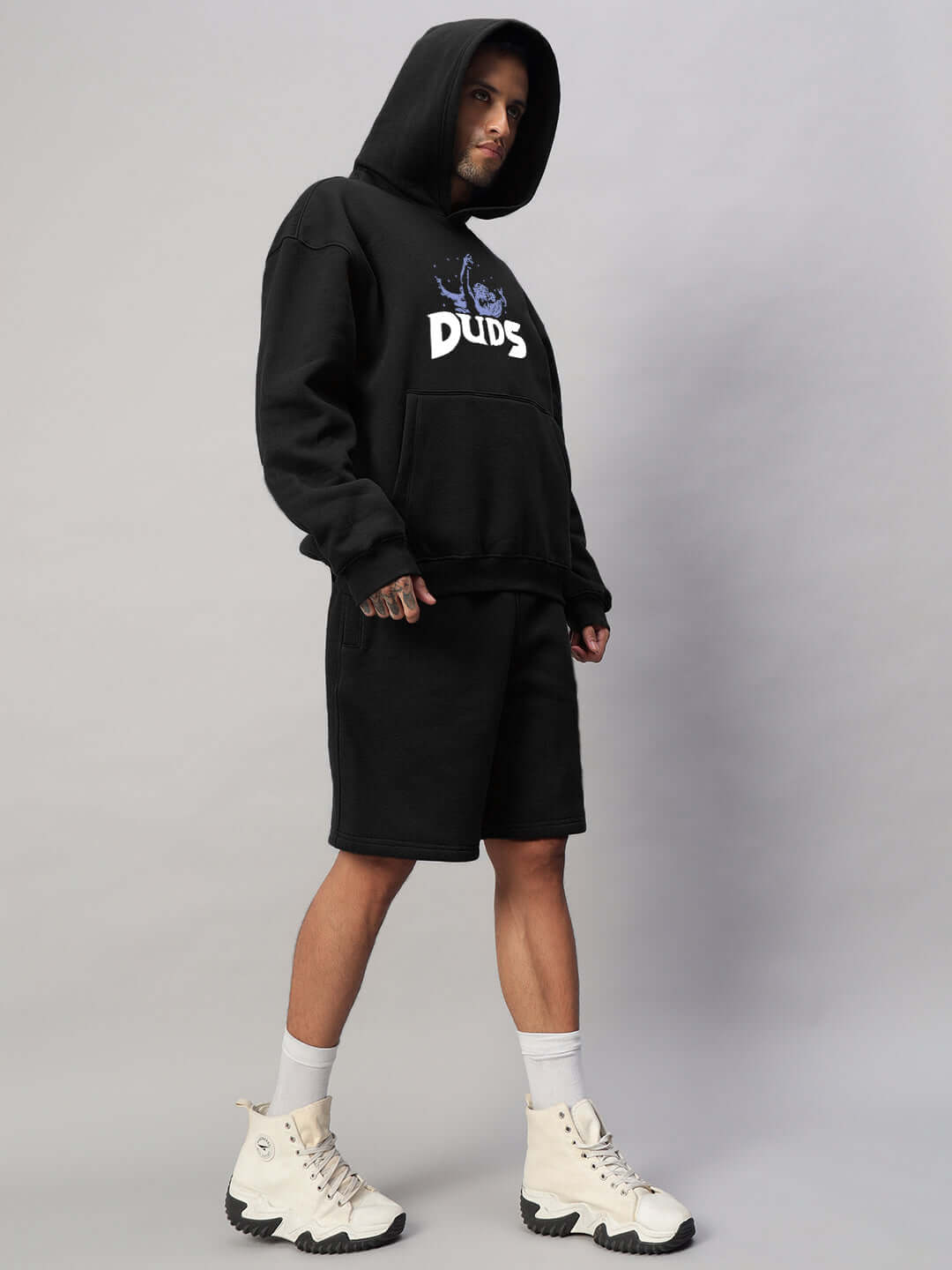 Model wearing WEARDUDS DREAMER FLEECE HOODIE BLACK, showcasing made-to-order stylish comfort with customizable fit options.