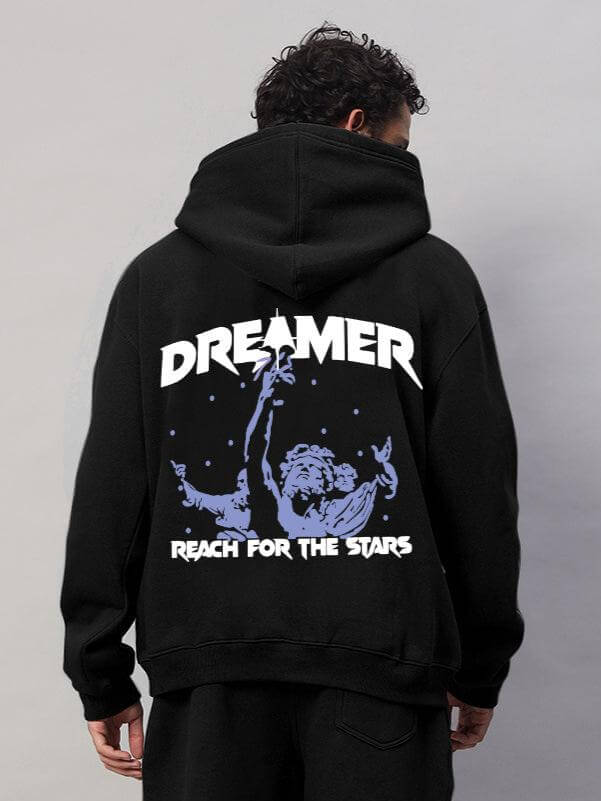 Back view of WEARDUDS DREAMER FLEECE HOODIE BLACK featuring 'DREAMER' and 'REACH FOR THE STARS' design.