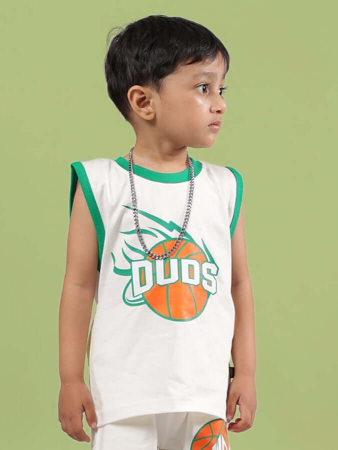 Child wearing DRIBBLE T-SHIRT FOR BOYS & GIRLS OFF WHITE with green accents and basketball design.