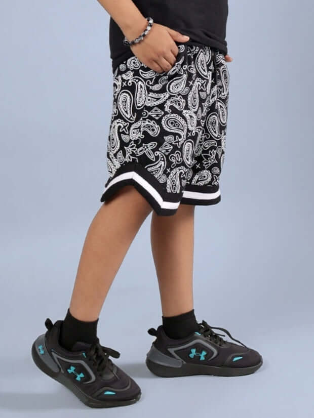 DRIZZLE SHORTS FOR BOYS & GIRLS BLACK, paisley design, child wearing stylish shorts, comfortable fit, casual fashion.