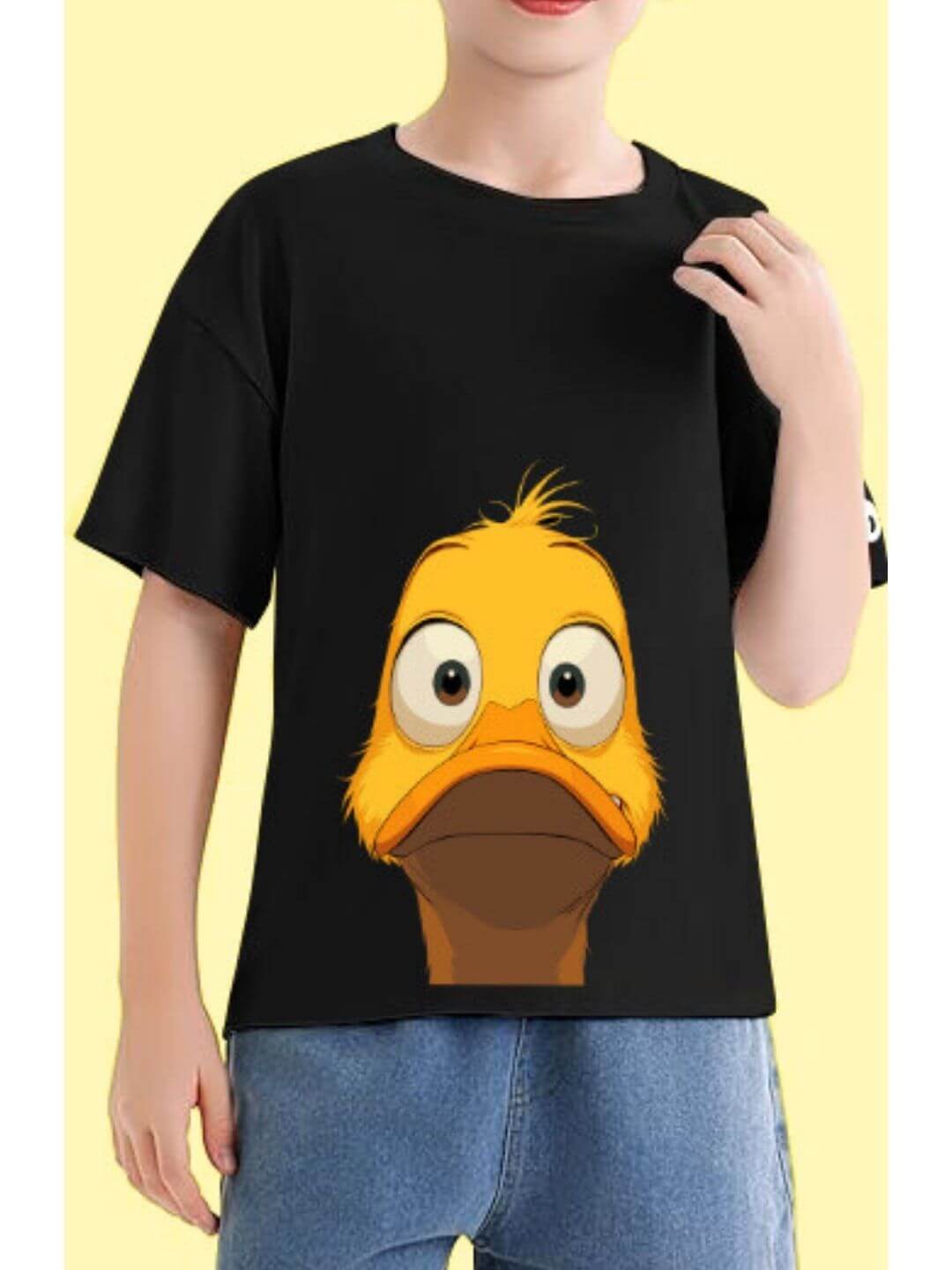 Child wearing DUCK FACE T-SHIRT FOR BOYS AND GIRLS BLACK with cartoon duck graphic, playful fashion for kids.