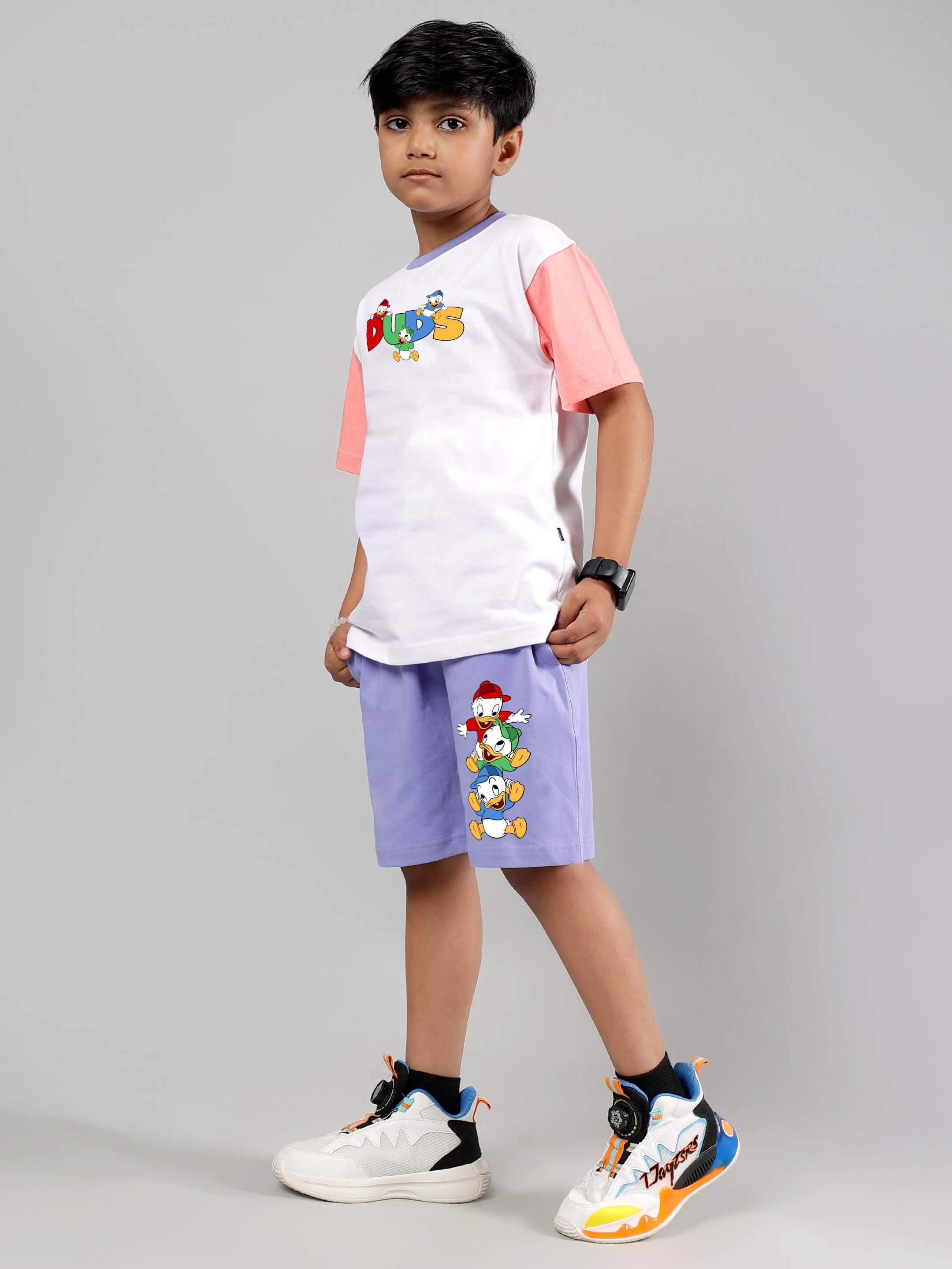 Boy wearing DUCK PLAY CO-ORD FOR BOYS GIRLS WHITE LAVENDER, showcasing playful duck print design.
