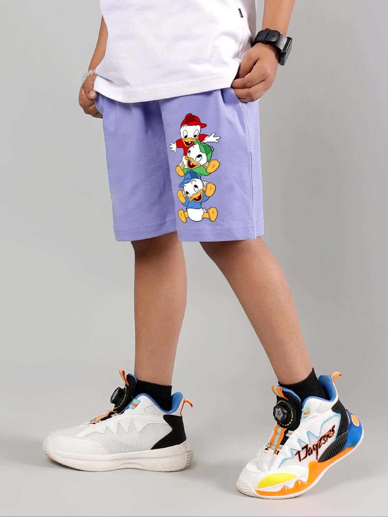 Child wearing DUCK PLAY SHORTS FOR BOYS GIRLS LAVENDER with duck design and white sneakers.