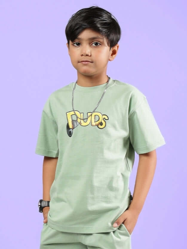 Child wearing Duck Tales T-Shirt for Boys Girls Nyanza Green featuring classic cartoon design against a purple background.