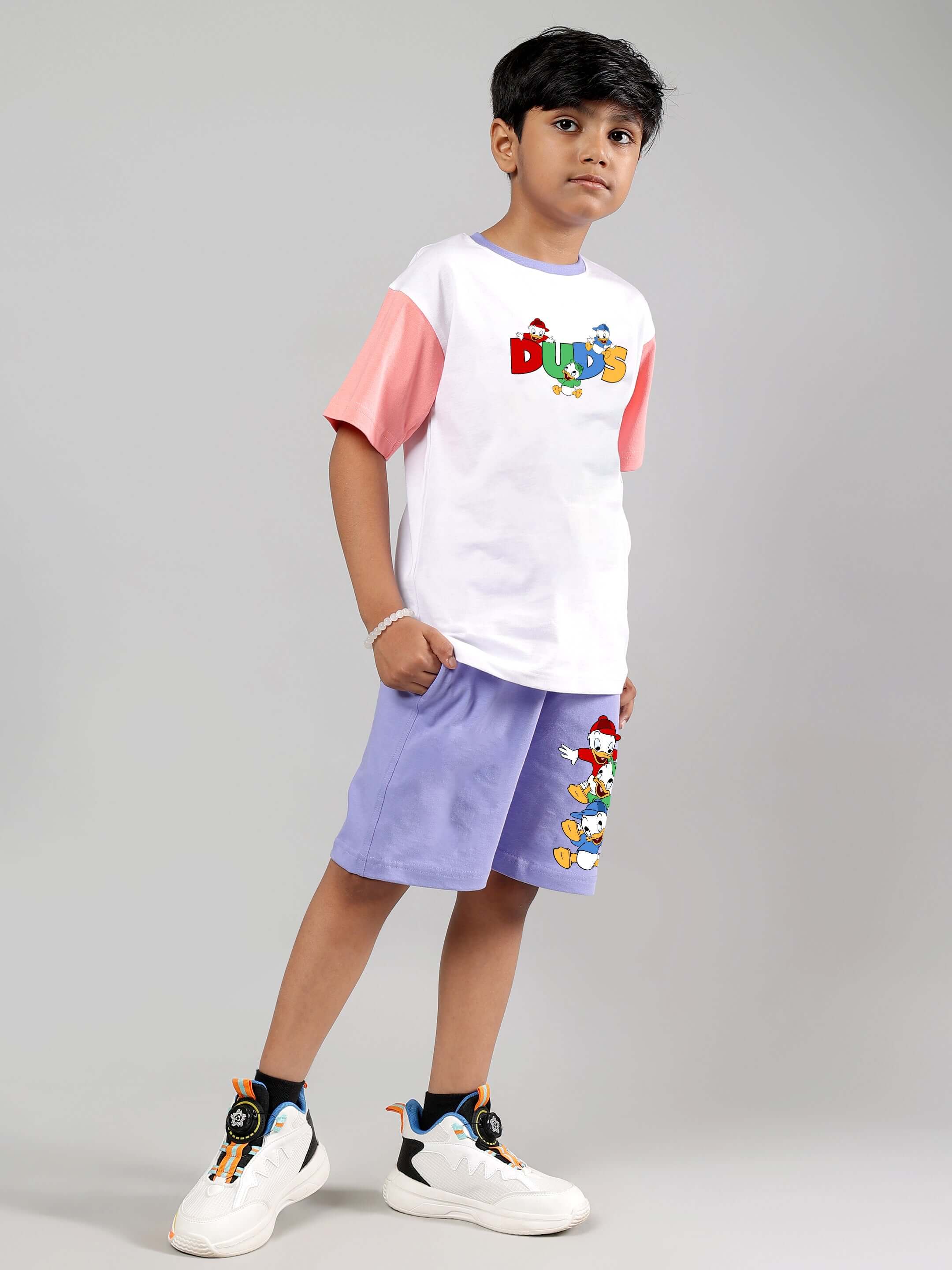 Boy wearing DUCK PLAY CO-ORD FOR BOYS GIRLS WHITE LAVENDER, featuring a playful duck design, lightweight breathable cotton set.