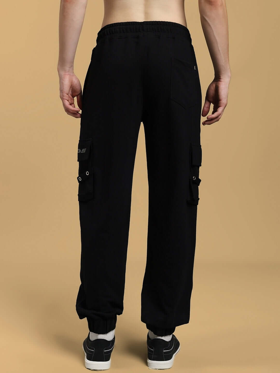 Back view of black DUDS Commando Joggers showcasing custom fit options, made to order by experienced tailors.