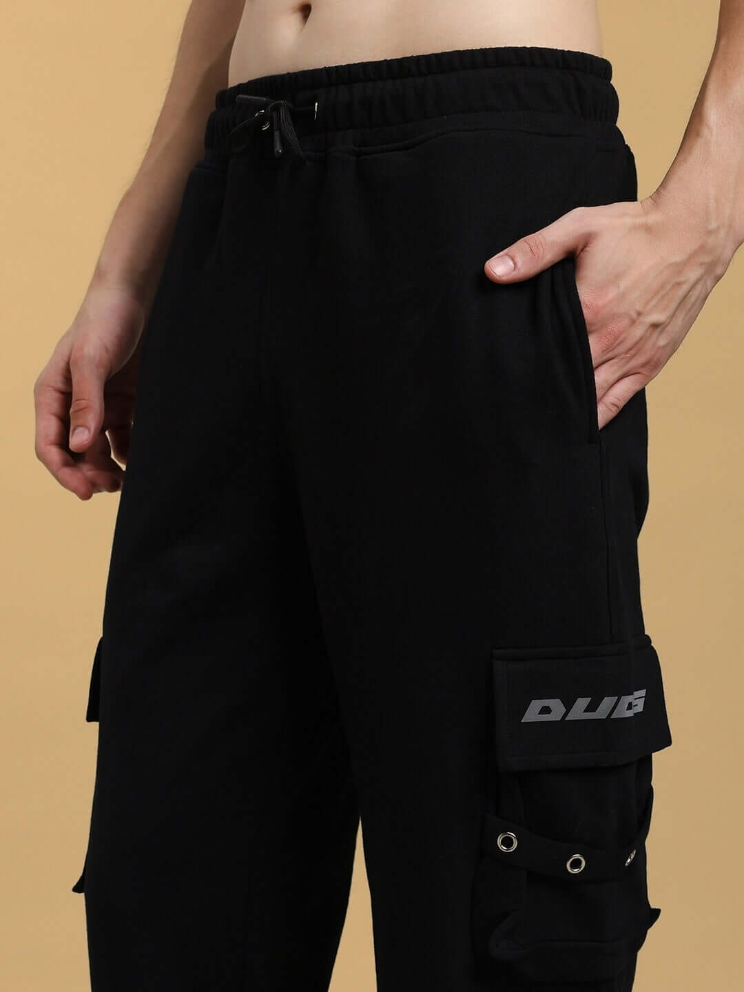 Close-up of black DUDS Commando Joggers with pocket detail, highlighting custom-fit option and premium craftsmanship.