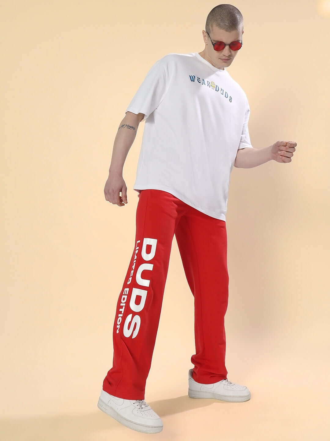 Man wearing DUDS Limited Edition Red Jogger and white t-shirt, displaying casual style.